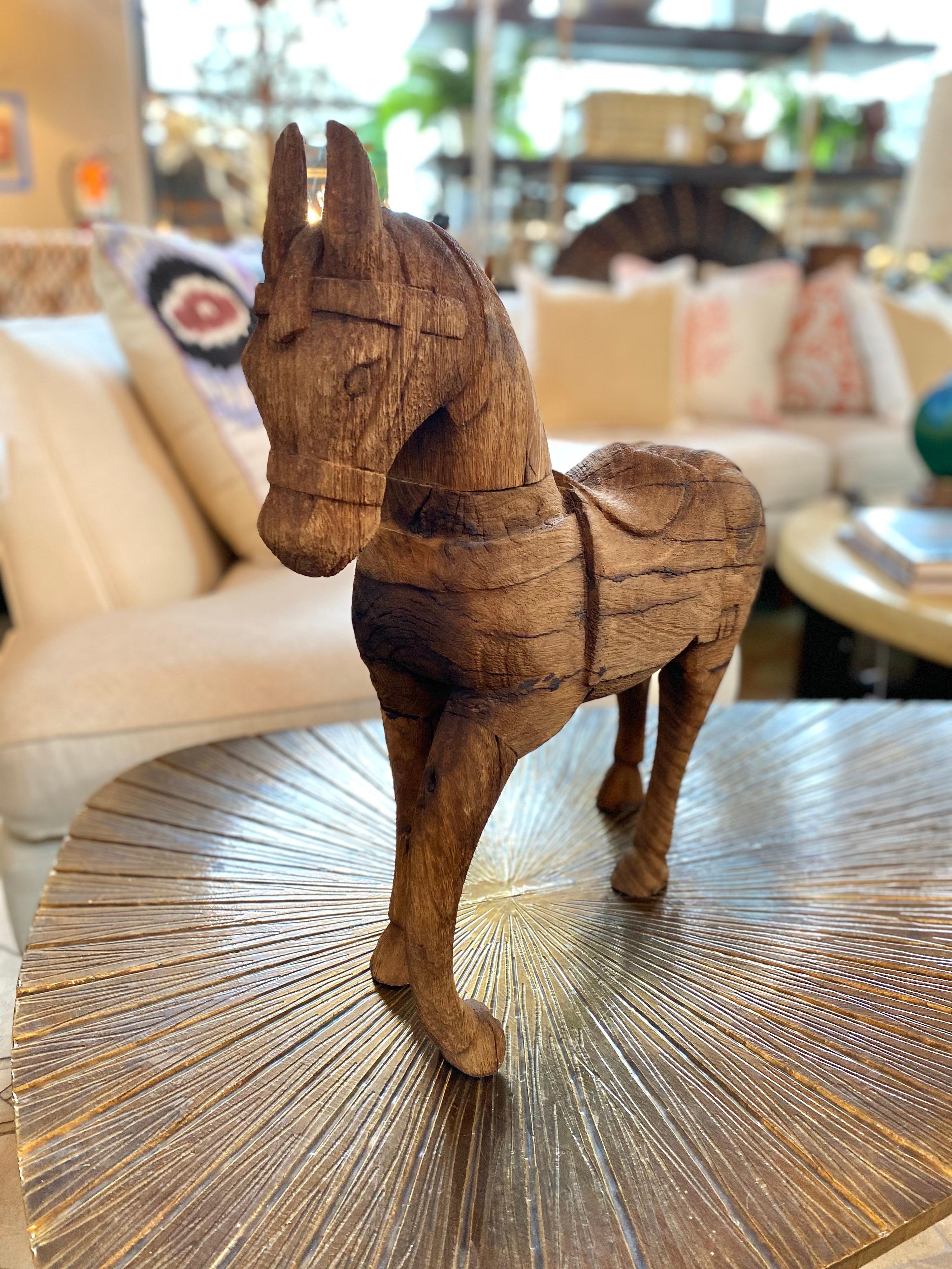 Dark carved wood horse.

Measures: 18