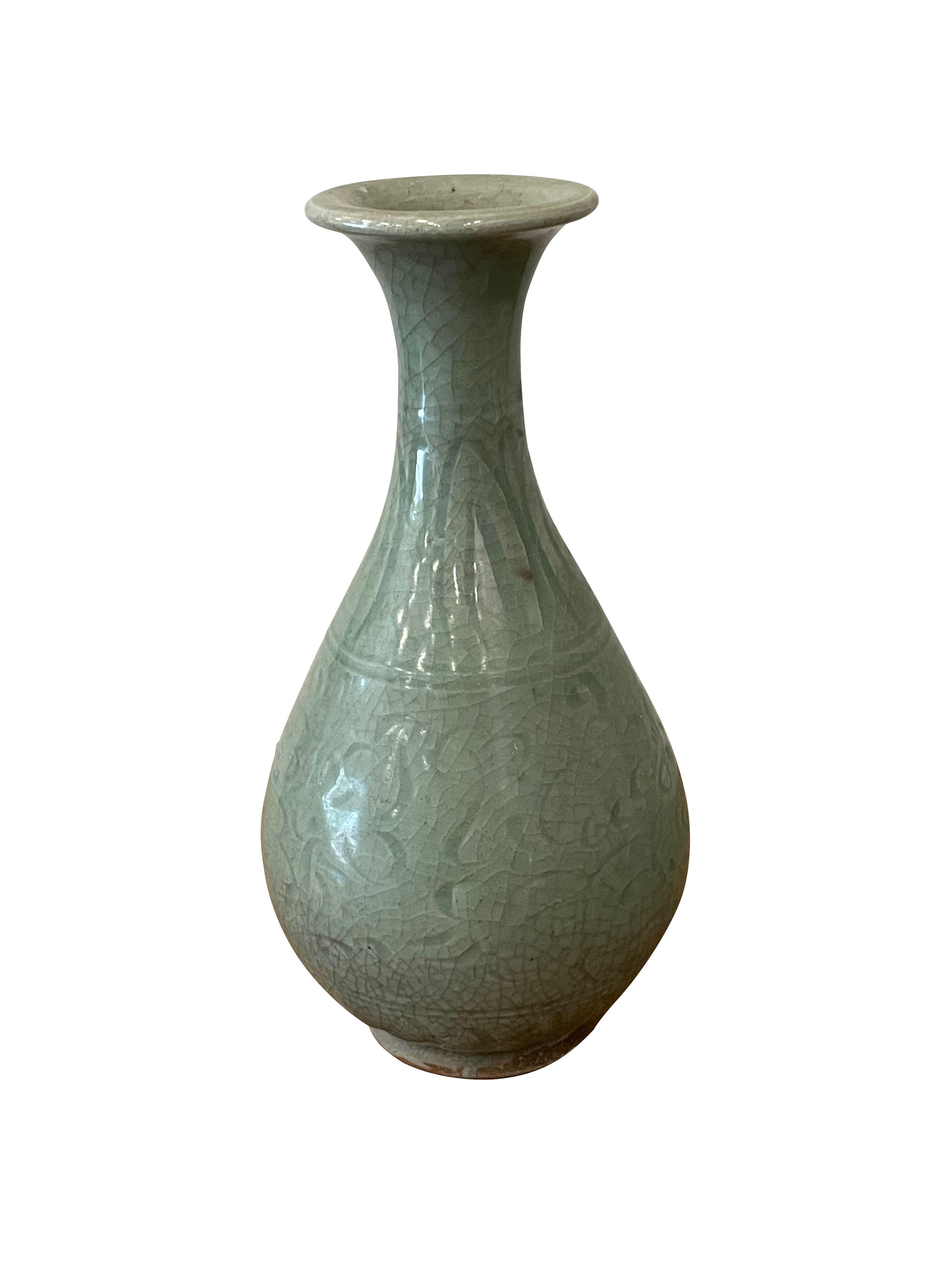 Contemporary Chinese dark celadon glaze vase.
Tulip shape with overall pattern.
Part of a collection.