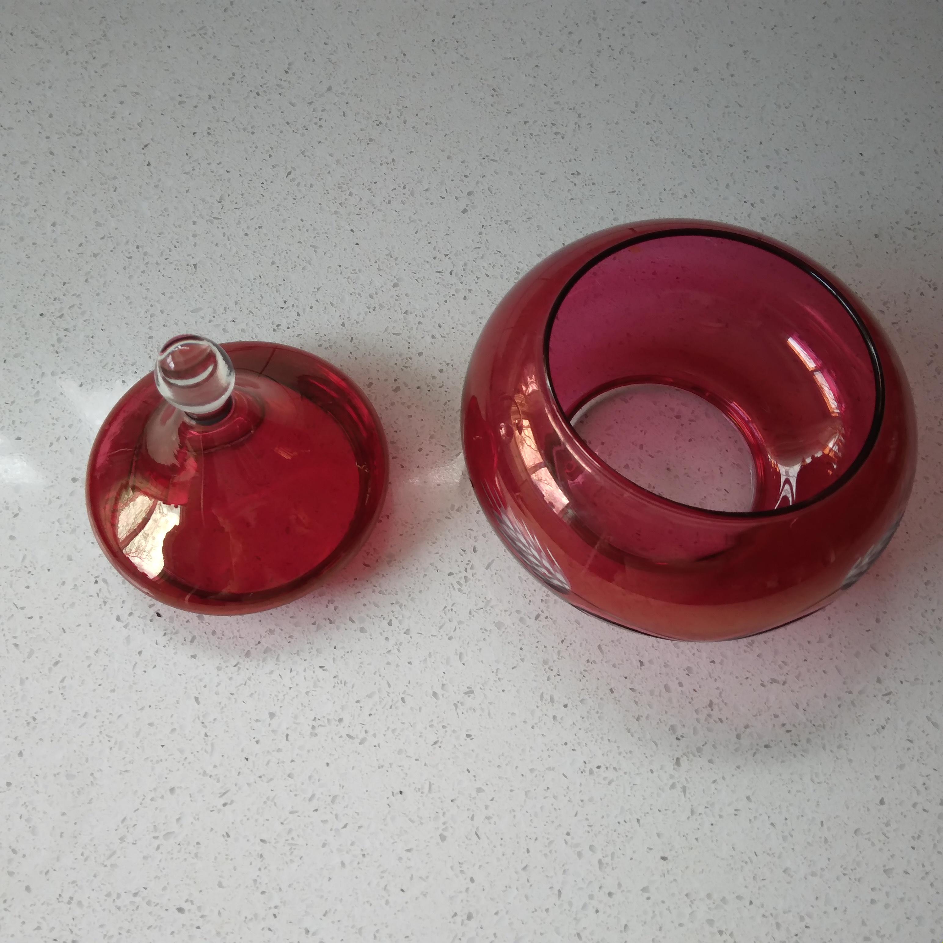 Gorgeous in cranberry and crystal, this vintage dish features an vintage wheat design and adorable, rounded shape. Perfect for a candy dish or sugar bowl. Some wear to pink from normal use.