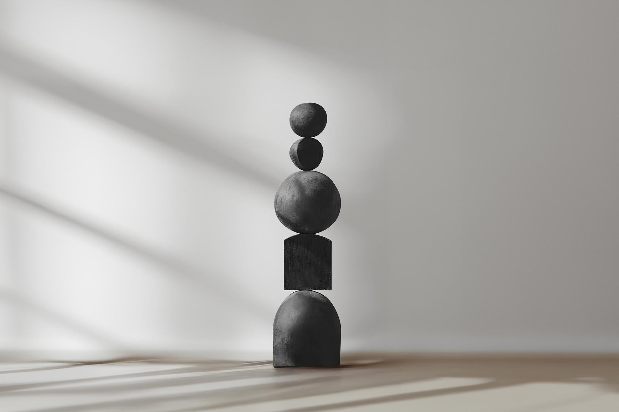 Dark Elegance Carved in Black Solid Wood, NONO's Still Stand No86
——

Joel Escalona's wooden standing sculptures are objects of raw beauty and serene grace. Each one is a testament to the power of the material, with smooth curves that flow into one