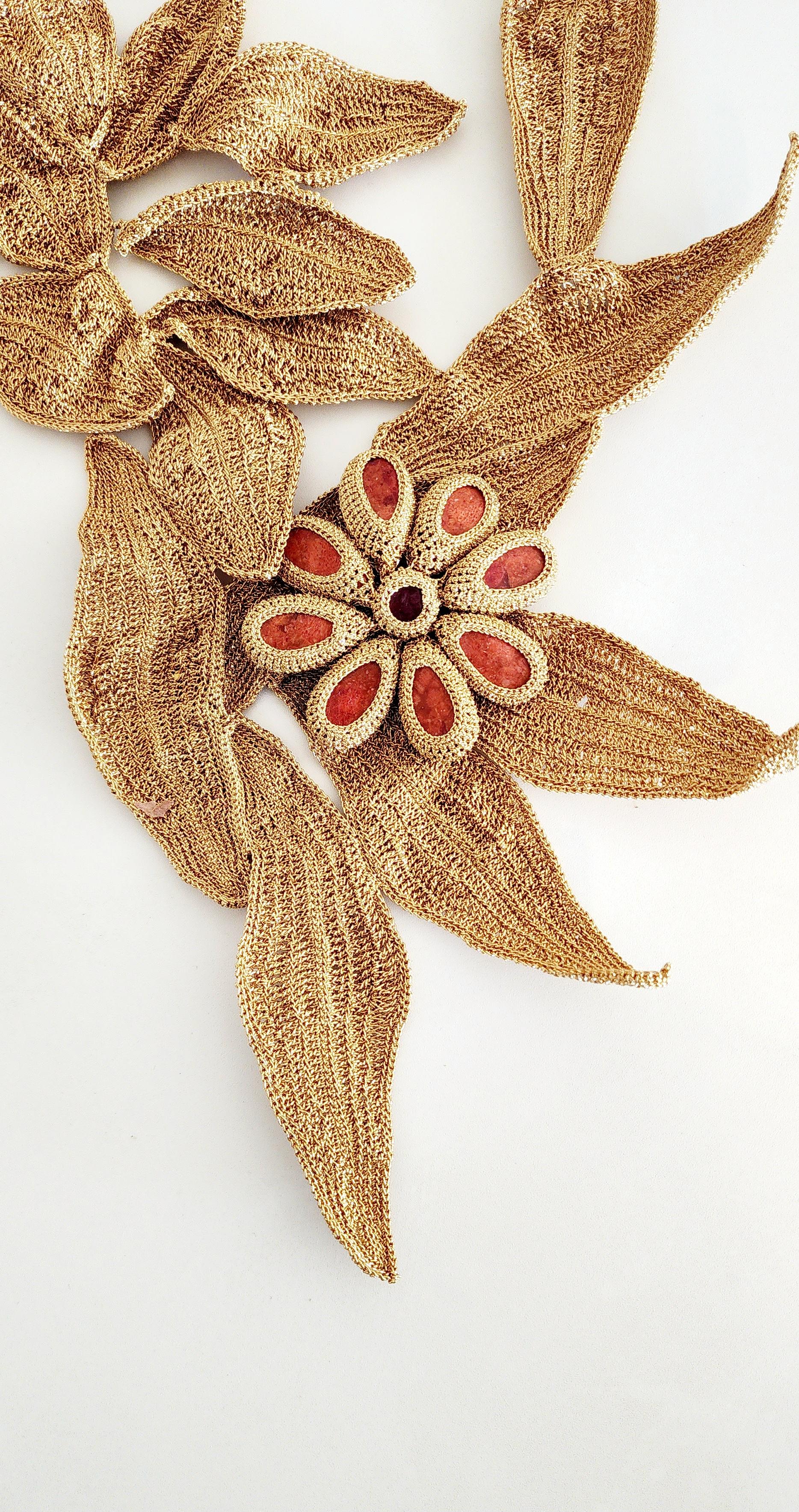 A wonderfully sculptural Necklace. It is Crochet with dark golden smooth passing thread with red coral stones. This is a statement piece. Nature is the inspiration for this one of a kind piece. Autumn leaves and autumn colors. Intricately Crochet. 