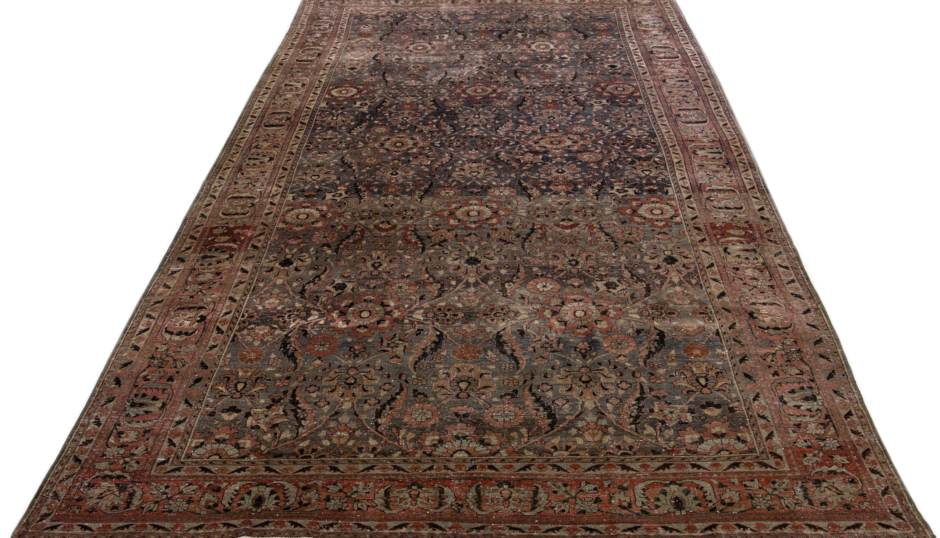 This magnificent Antique Malayer rug is hand knotted from Wool in a delightful gray hue. Its intricately patterned floral motifs come alive with vivid multi-hued accents.
 
This rug measures: 8' x 16'4