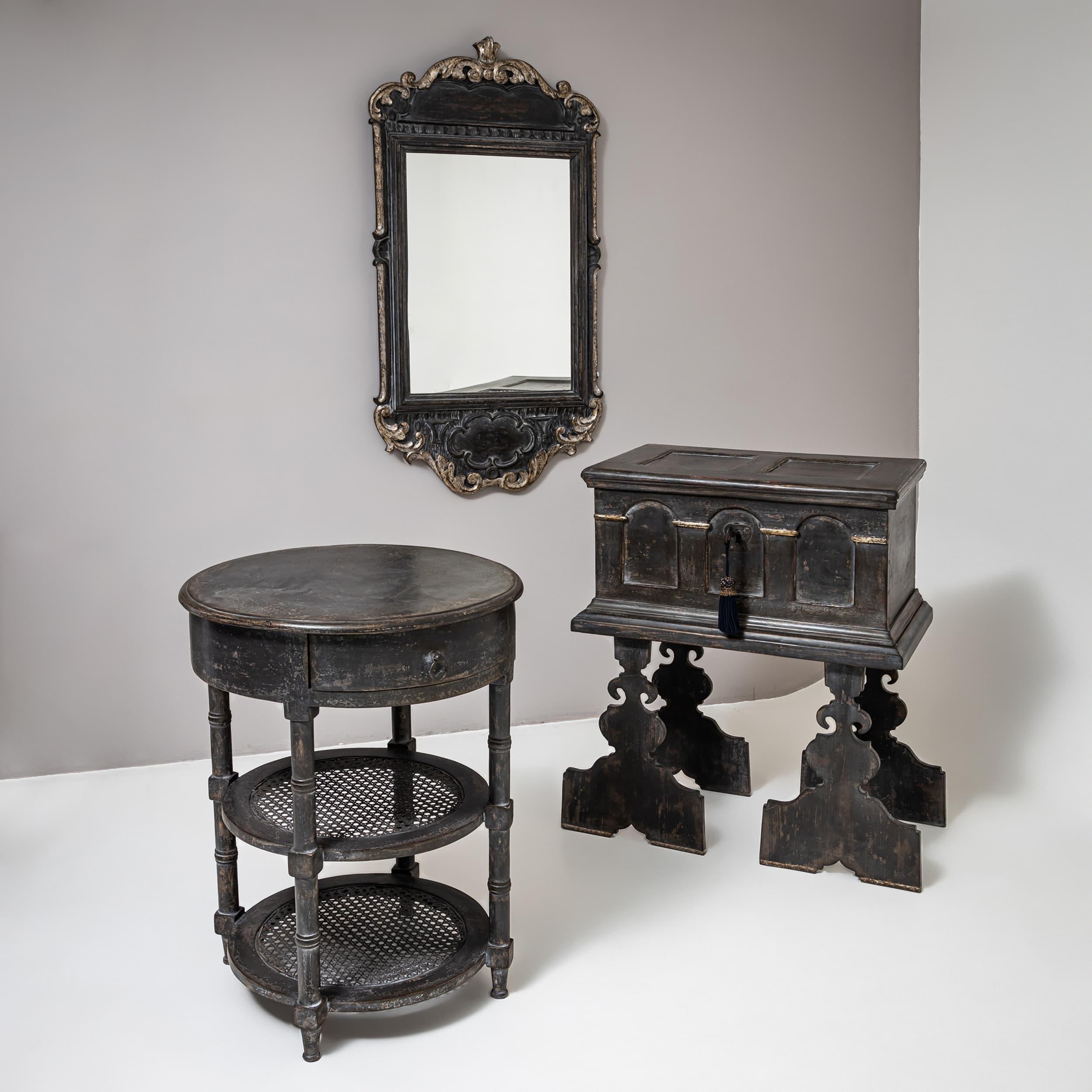 Dark gray Louis XVI style side table with a round tabletop, a single drawer, and two cane-woven shelves. The finish is newly applied and antiqued with a patina.