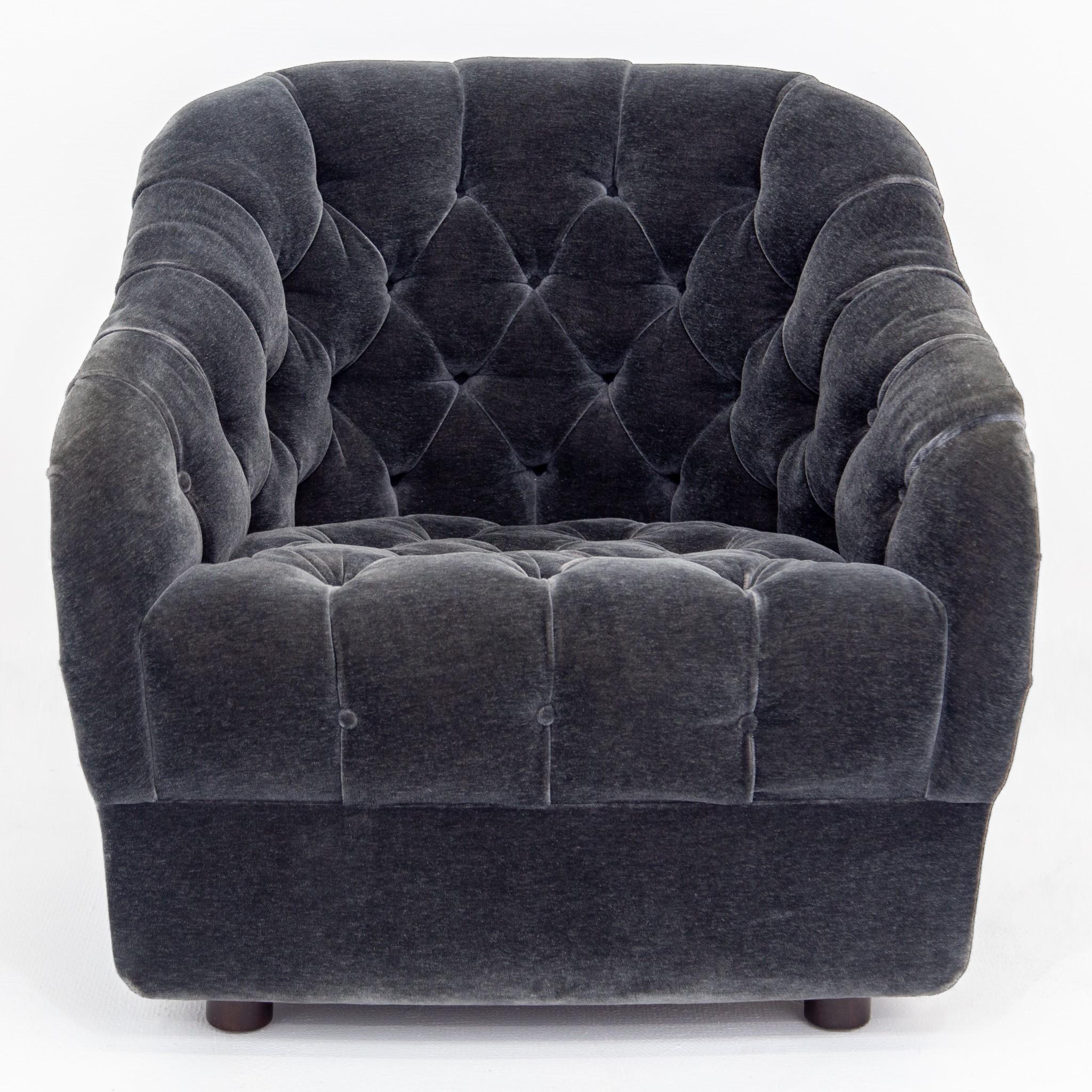 Mid-Century Modern barrel back lounge/club chair with original dark gray deep button tufted velvet upholstery. Designed by Ward Bennett for Brickel Associates with labels attached, dated 1987. Sits on four short cylindrical walnut feet. Extremely