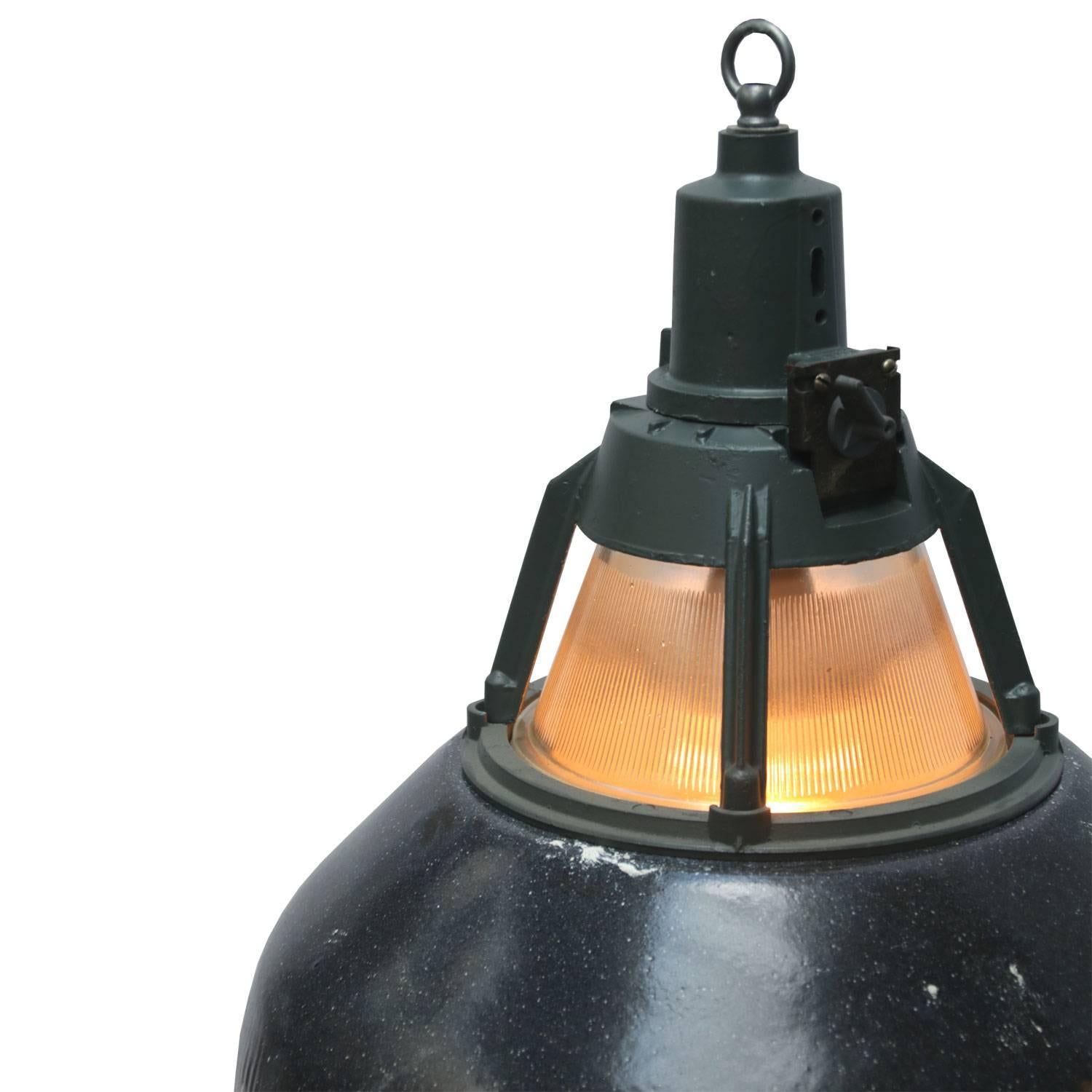 Enamel Industrial pendant. Green enamel shade, white inside.
Dark grey/green cast aluminium top.

Weight: 2.8 kg / 6.2 lb

All lamps have been made suitable by international standards for incandescent light bulbs, energy-efficient and LED bulbs.