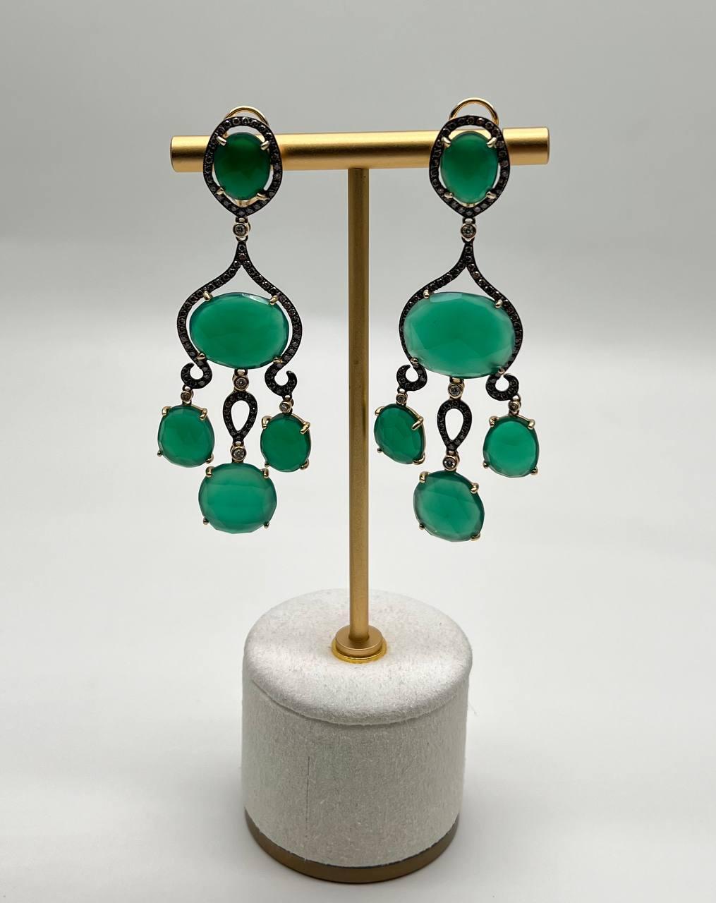 Enhance your elegance with these stunning earrings crafted in 14k gold, featuring carats of vibrant green agate. 

The rich green hue of the stones offers a captivating allure, ideal for any sophisticated event or evening affair.

Intricate, bold,