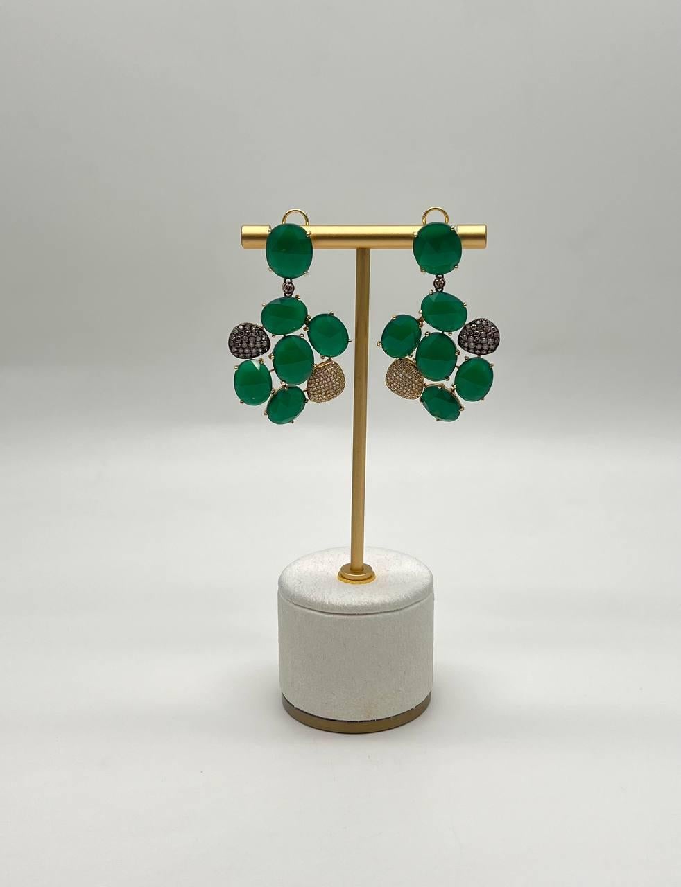 A pair of earrings featuring 39.54 carats of green agate set in 14K gold. 1.46 ctw Diamonds.
These are sure to make a statement.
