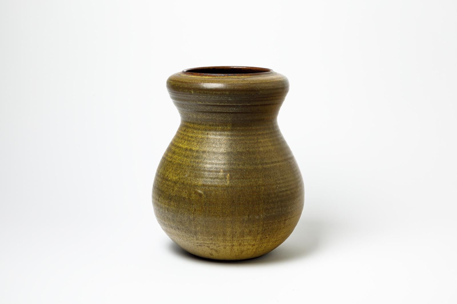 dark green and brown glazed stoneware vase by Daniel de Montmollin.
Artist signature under the base. 
Circa 1990-2000.
H : 13.4’ x 9.4’ inches.