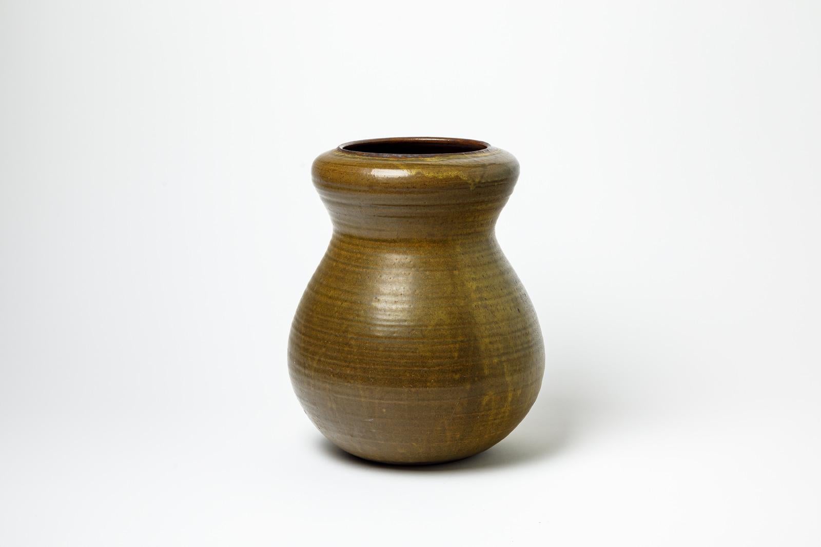 French dark green and brown glazed stoneware vase by Daniel de Montmollin, 1990-2000. For Sale