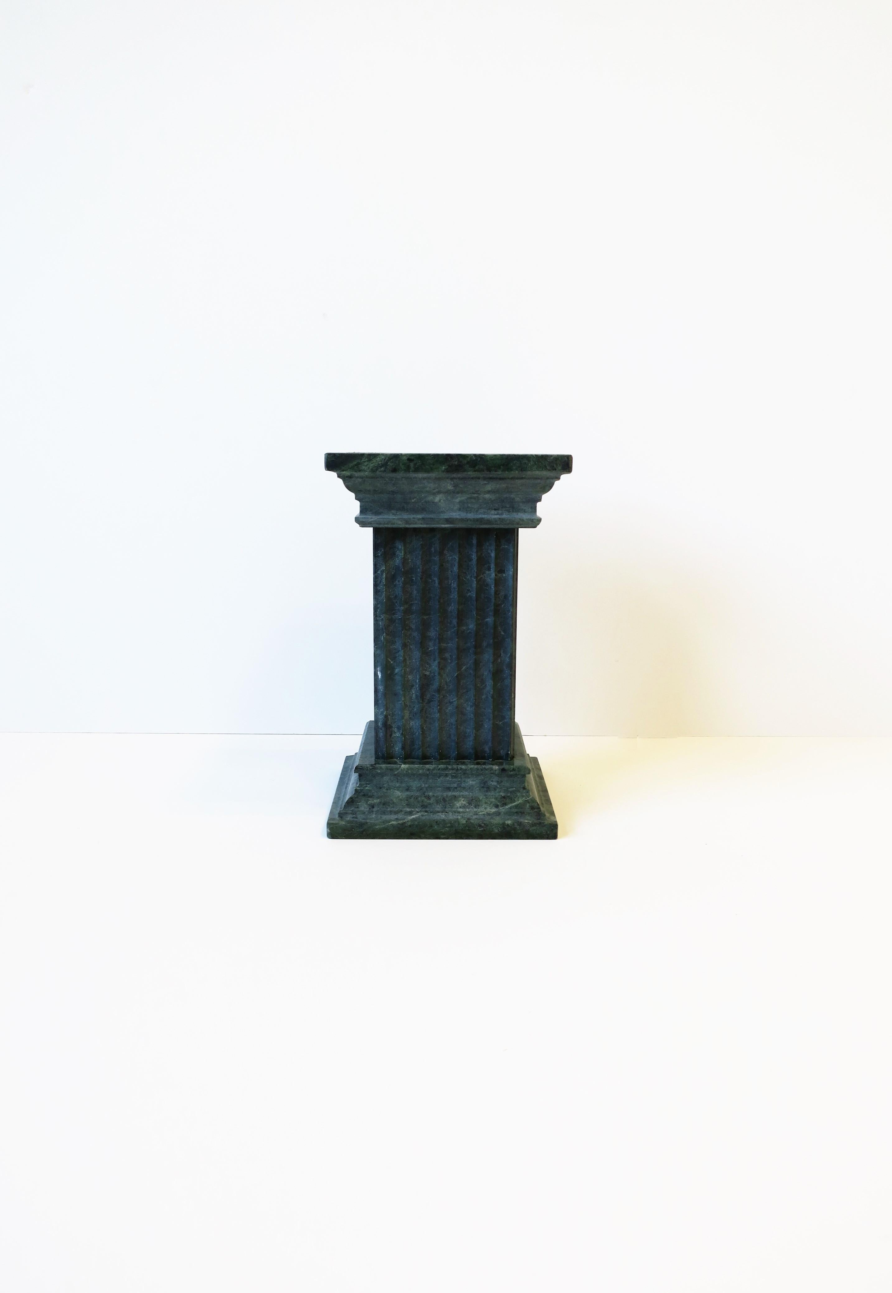 A substantial green and white marble column pillar bookend or decorative object, circa late 20th century. A small pillar column pedestal stand or bookend is in excellent condition. Column architecture is in the style of the 'fluted non-tapered