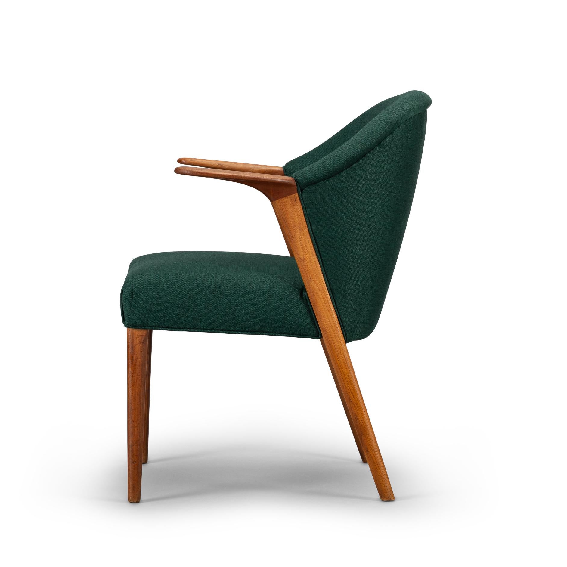 Elegantly designed solid oak armrests give flavour to this chair. Made in Denmark in the 1950s by Larsen & Søn Snedkermestre this particular one is newly upholstered with a Kvadrat Balder 3 fabric that gives it a hip look. The Kvadrat Balder 3 is a