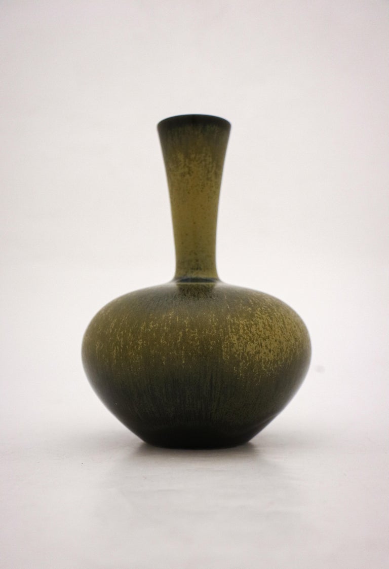 A lovely dark green vase with a har fur glaze designed by Sven Wejsfelt at Gustavsberg in Stockholm in 1986. The vase is 16.5 cm high. It's marked as on picture. It is in excellent condition.