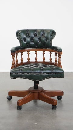 Dark green chesterfield office chair in cowhide leather on wheels