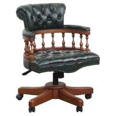 Dark green chesterfield office chair in cowhide leather on wheels