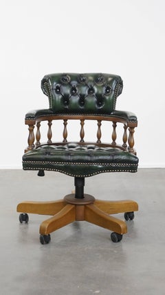 Dark green cowhide leather and wood chesterfield office chair on wheels