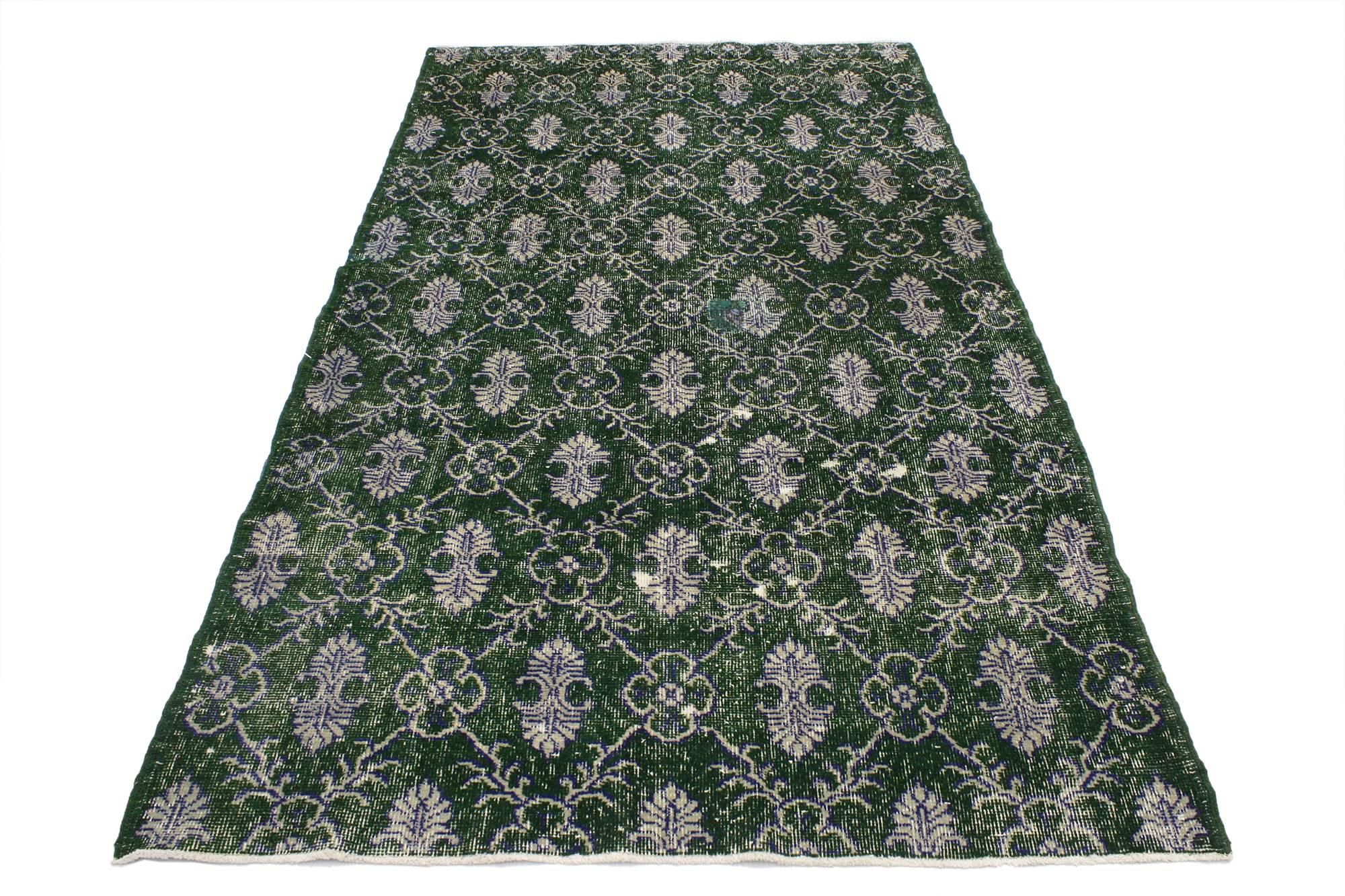 51945, Zeki Muren Dark Green Distressed Vintage Turkish Rug With Industrial Art Deco Style, 04'01 x 07'04. This hand-knotted wool dark green distressed vintage Turkish Sivas rug with modern Industrial Art Deco style features a cusped lozenge garden