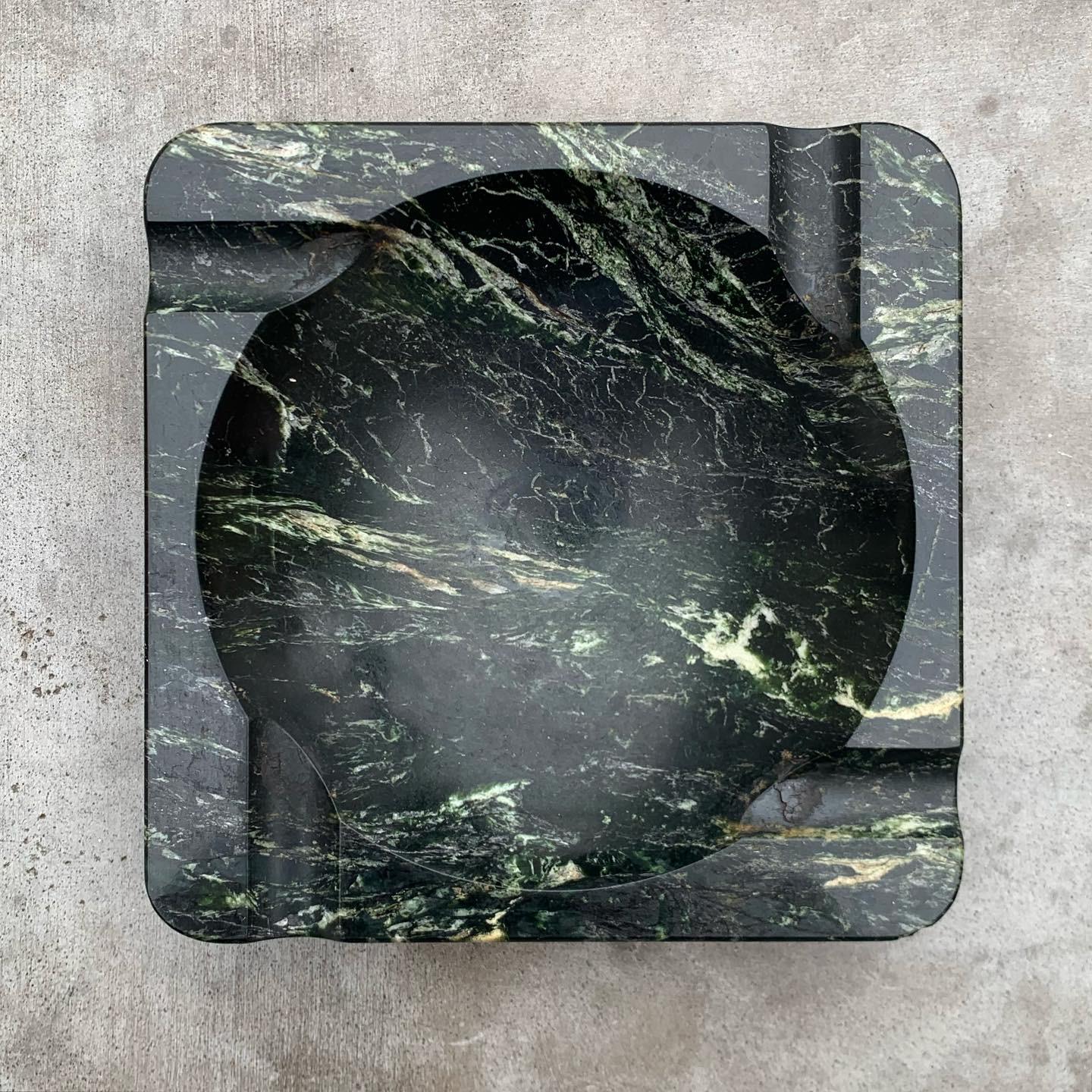 Vintage Mid-Century Modern marble ashtray in dark pine green with ivory veining.