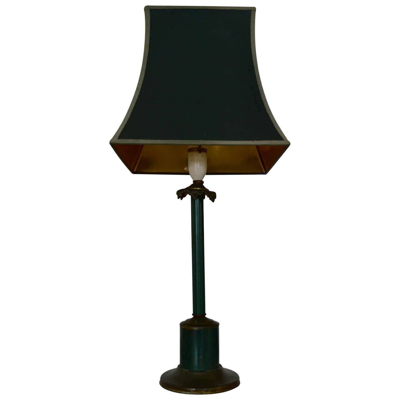 A column-shaped 1920s Neo-classical toleware and bronze table lamp.
Then base has a green paint and patinated finish, with acanthus leaves around the neck.