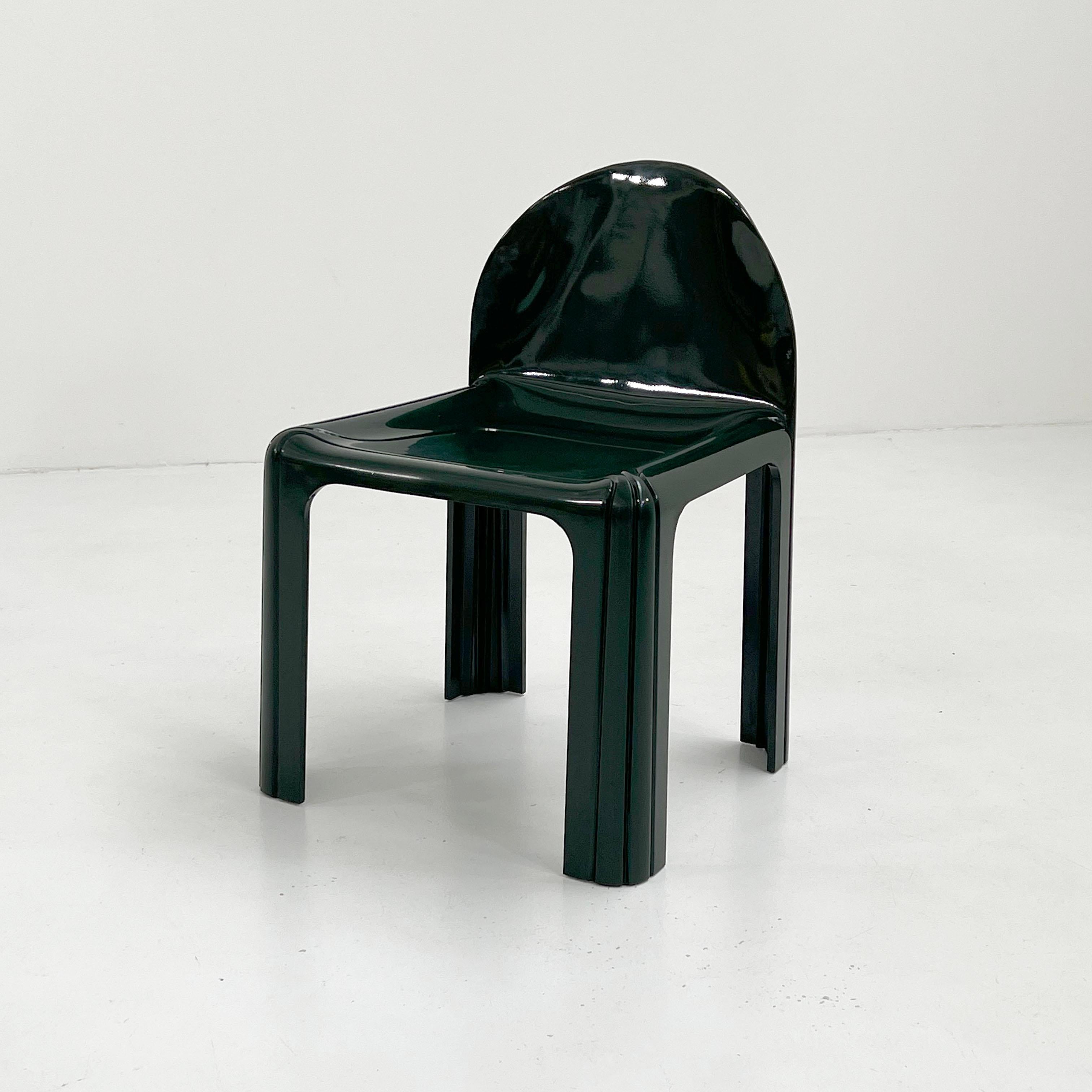 Designer - Gae Aulenti
Producer - Kartell
Model -  Model 4854 Dining Chair
Design Period - Seventies 
Measurements - Width 51 cm x Depth 47 cm x Height 75 cm x Seat Height 44 cm
Materials - Polyurethane
Color - Dark Green
Comments - Light wear