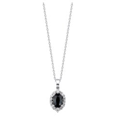 Collana aureola con zaffiro verde scuro e diamante