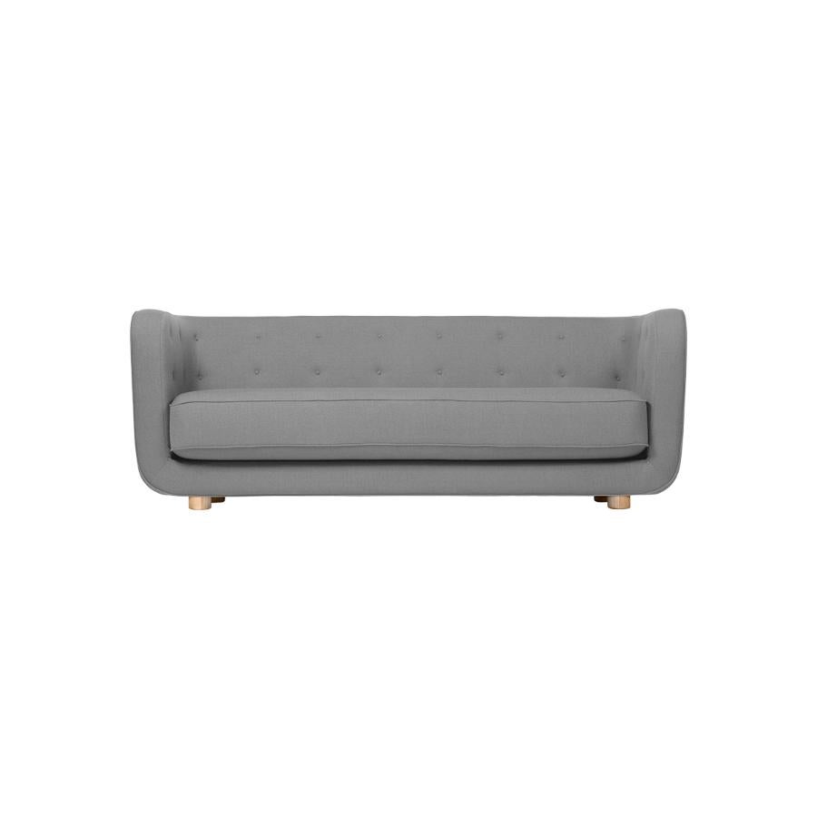 Dark grey and natural oak Raf Simons vidar 3 Vilhelm sofa by Lassen.
Dimensions: W 217 x D 88 x H 80 cm. 
Materials: Textile, Oak.

Vilhelm is a beautiful padded three-seater sofa designed by Flemming Lassen in 1935. A sofa must be able to