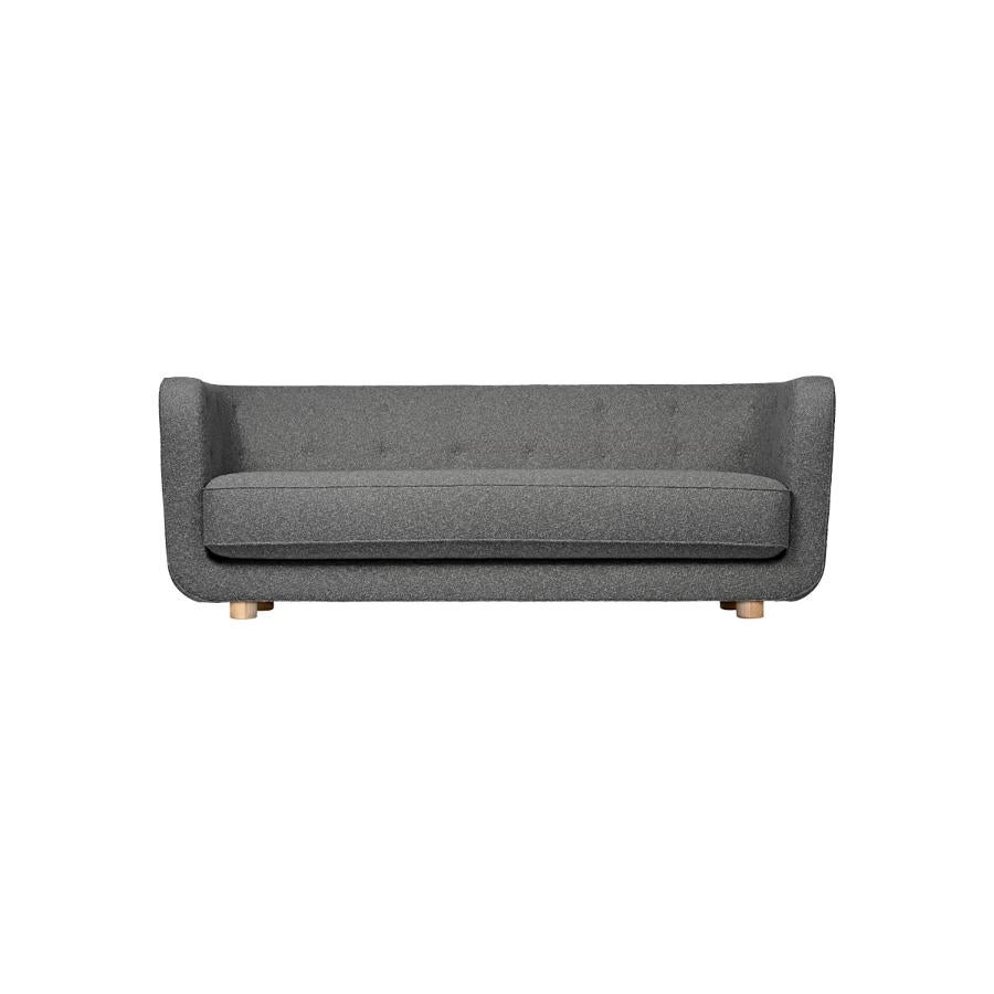 Dark grey and natural oak Sahco Nara Vilhelm Sofa by Lassen
Dimensions: W 217 x D 88 x H 80 cm 
Materials: Textile, Oak.

Vilhelm is a beautiful padded 3-seater sofa designed by Flemming Lassen in 1935. A sofa must be able to function in several