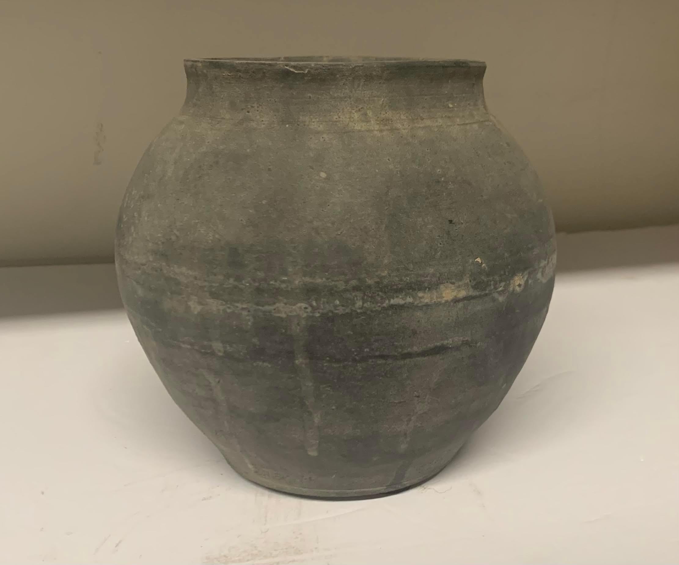 Late 20th century Chinese charcoal terracotta medium size food vessel.
An assortment of sizes and shapes are available and sold individually.
Each one is unique in its' weathered patina.
Sizes range from medium to extra extra large.
Measurements