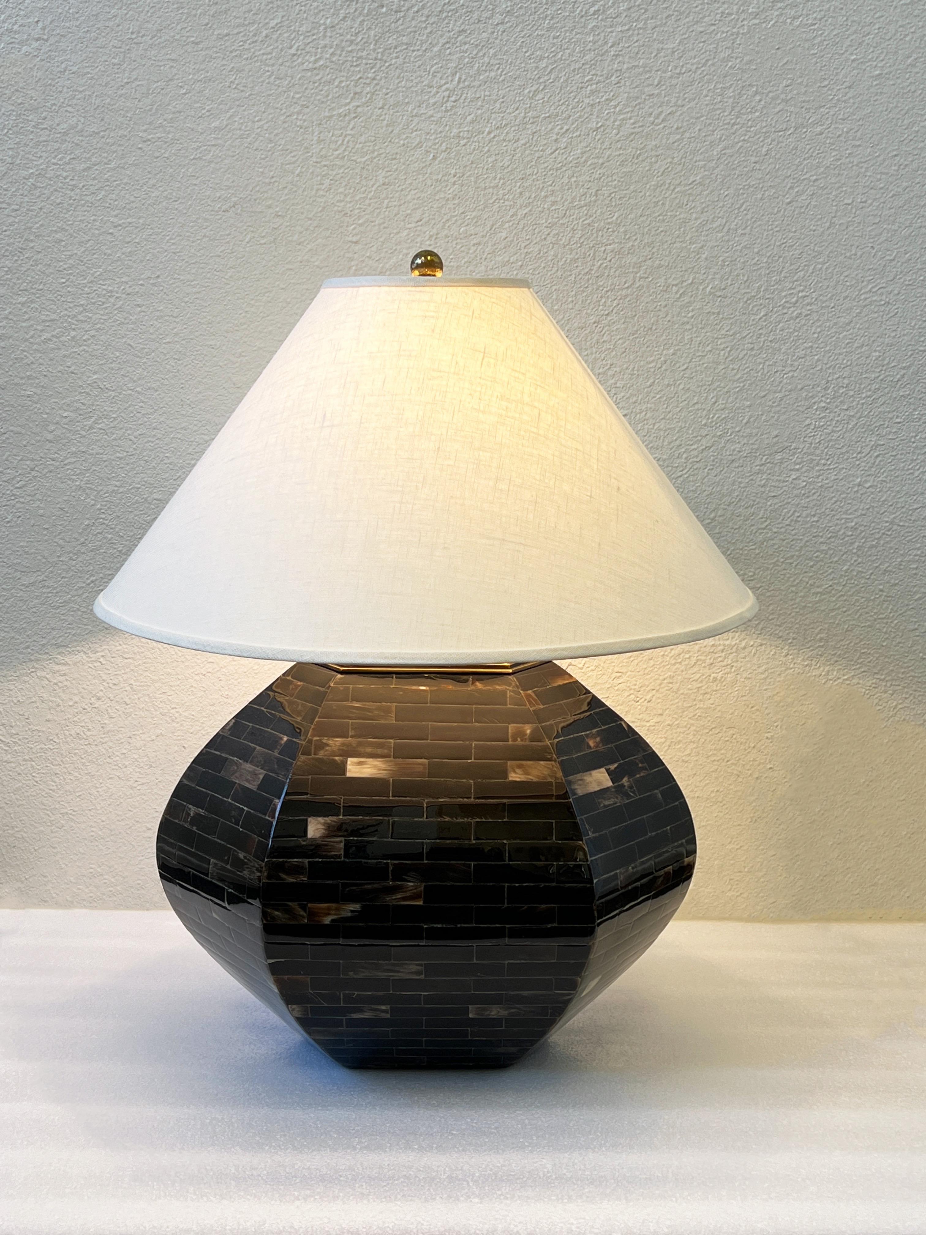 1980’s Oval hexagonal shape horn and aged brass table lamp by Colombian designer Enrique Garcel. 
Newly rewired and new vanilla linen shade. It takes a regular 75x max Edison lightbulb. 
In beautiful vintage condition. 
Measurements: 23.5” high,