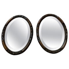 Dark Lacquered wooden carved Chinoiserie set of 2 Oval Wall Mirrors, 1920