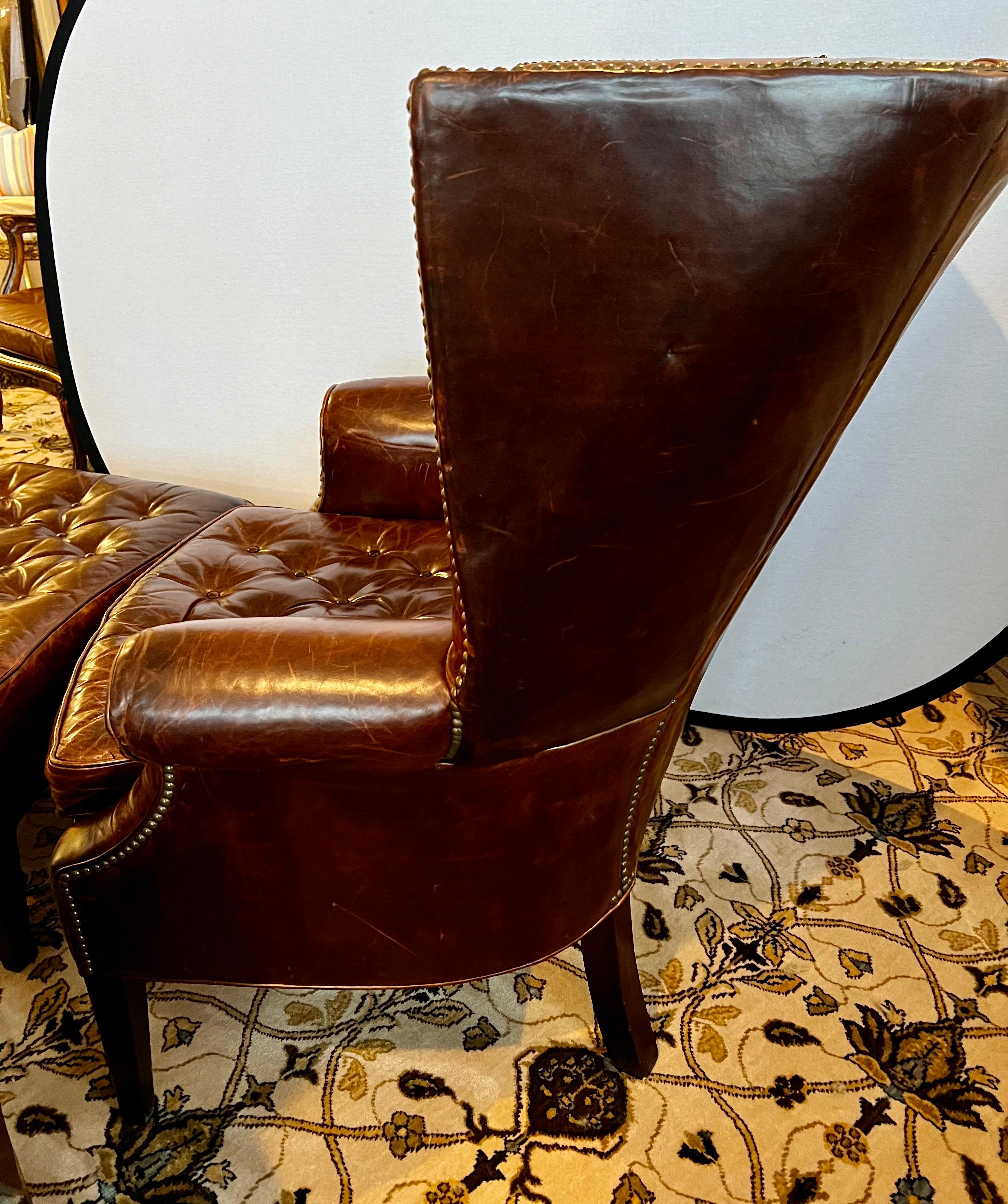 Elegant wingback dark brown leather wingback chair and ottoman combo with distressed leather patina that really adds to the appeal.  See all pics.