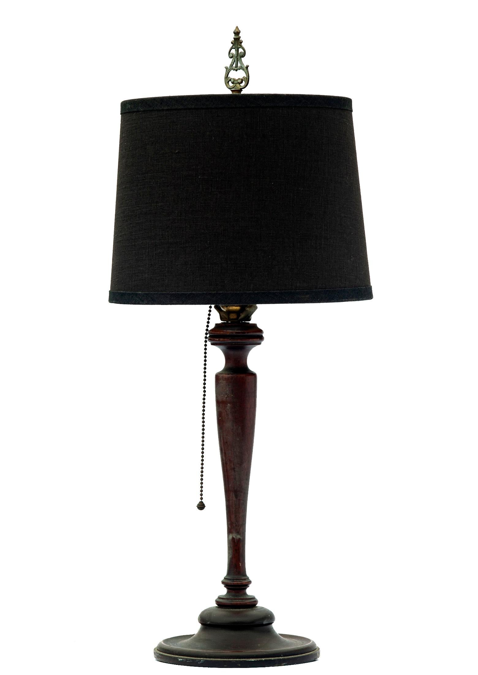 Antique Mahogany hand turned wood spool lamp. 
This table lamp in finely turned with original finish. The original extra-long brass pull chain ins in working order.
A new fine silk shade by RH is included.
Produced by an unknown studio