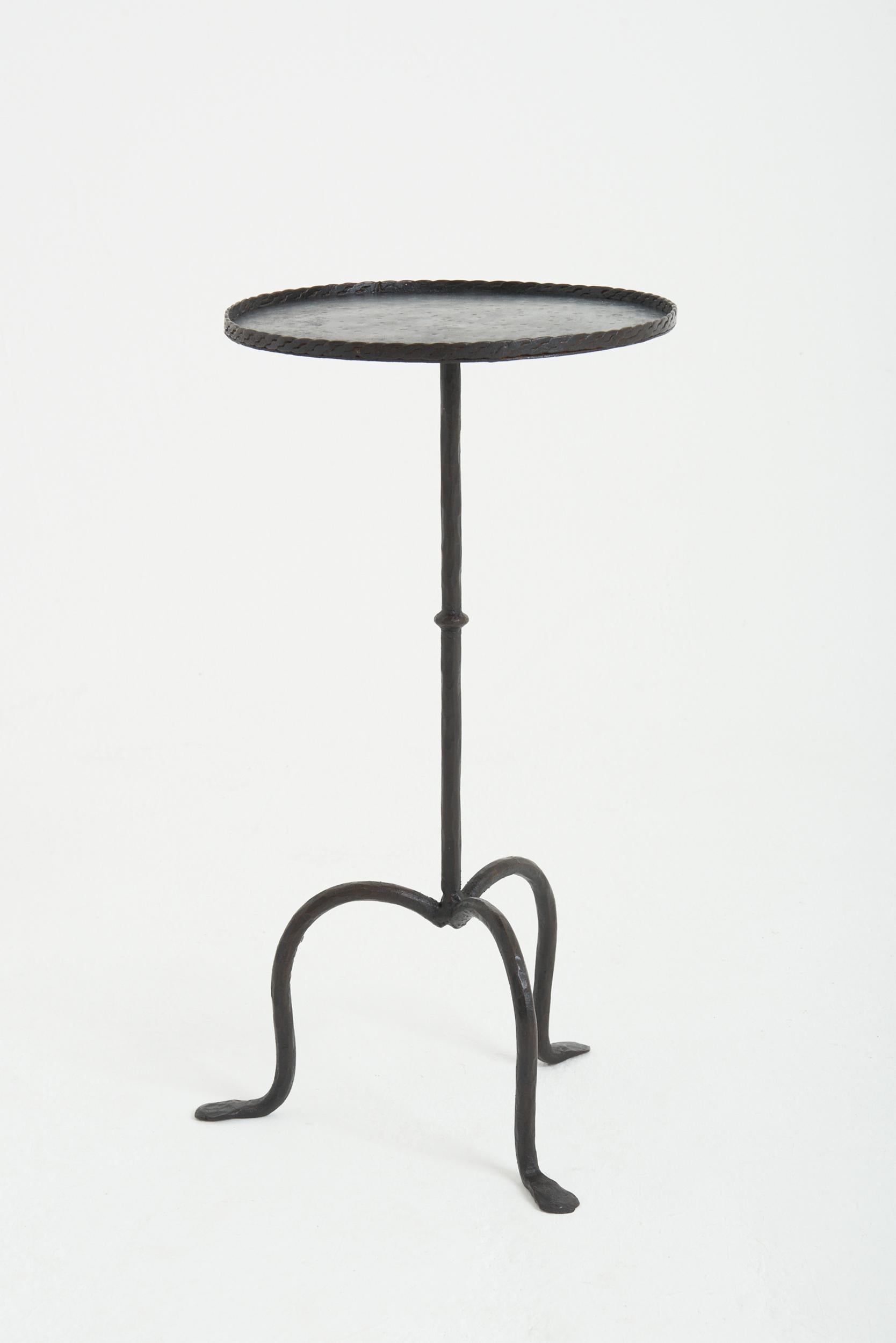 A wrought iron martini table.
Spain, mid 20th Century
58 cm high by 30.5 cm diameter