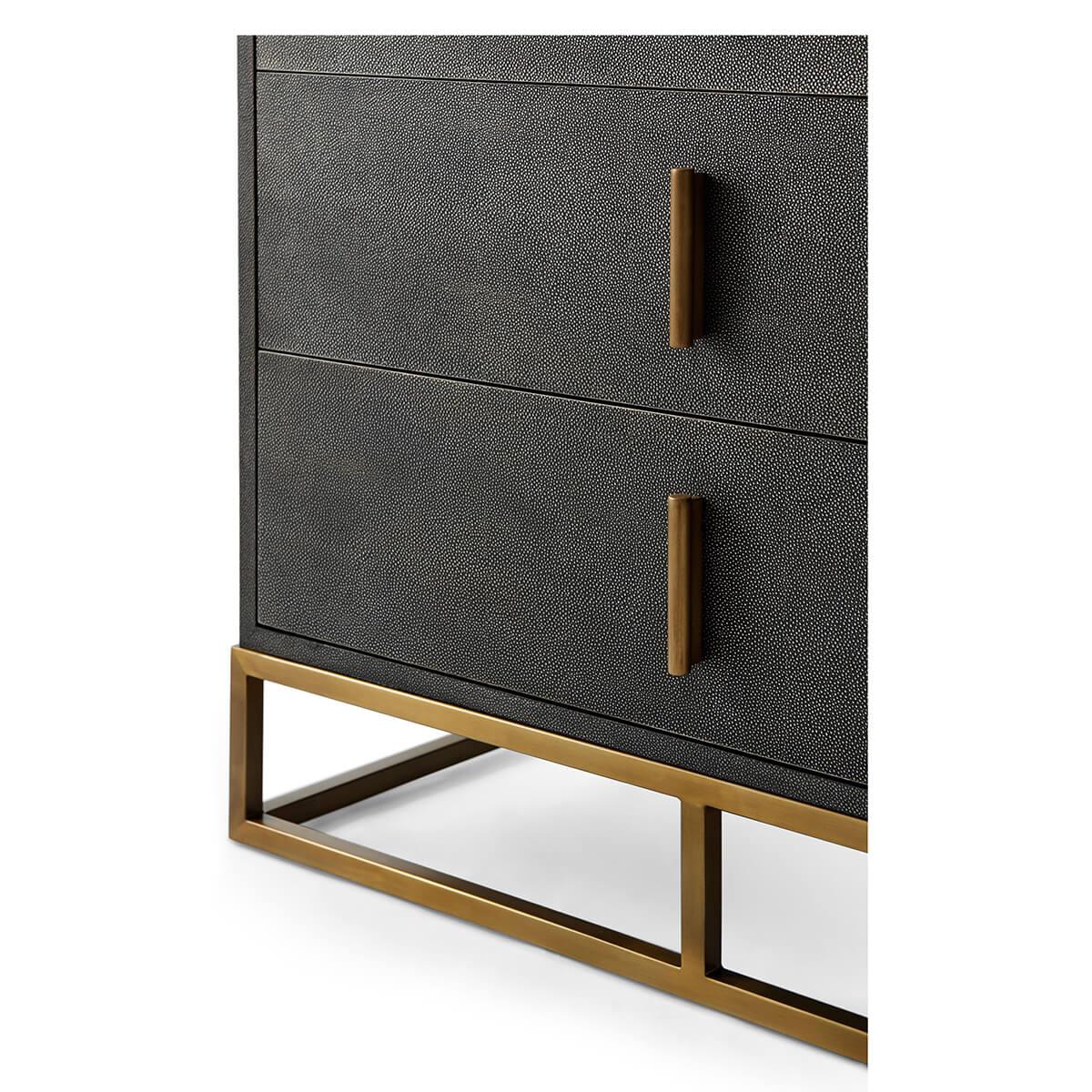 Wrapped in a shagreen embossed leather in our dark tempest smoke finish, with six long drawers and with brushed brass finish hardware and trim, all raised on a cube form brushed brass base.

Dimensions: 35.75