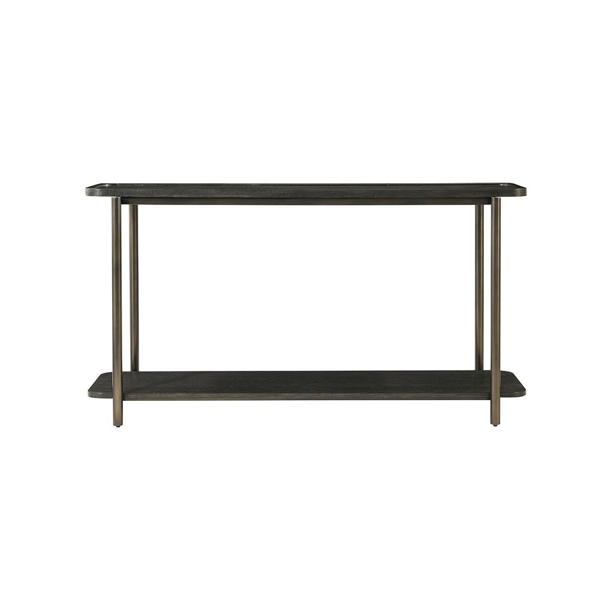 With a long sleek dishtop shelf supported by a tube form iron frame with a lower shelf stretcher base. Finished in a dark charcoal gray oak.

Dimensions: 60