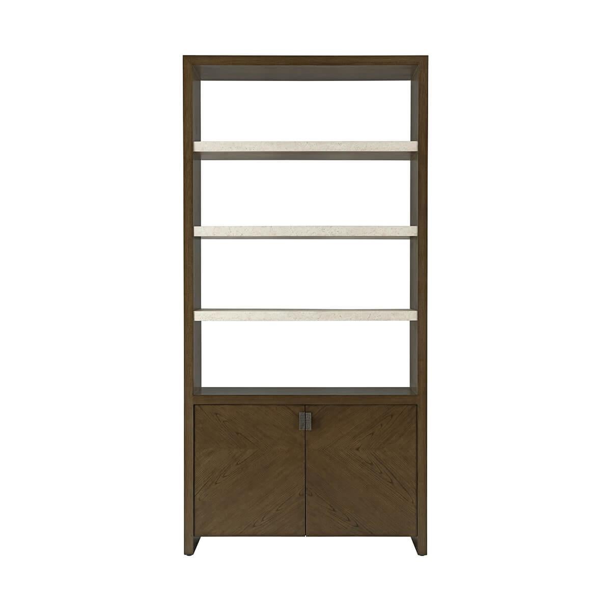 Modern Bookcase is a modern two-door bookcase in figured cathedral ash available in our dark earth finish with metal pulls in Ember. Completed three exposed fixed shelves in our exclusive porous Mineral finish. An adjustable shelf can be found in