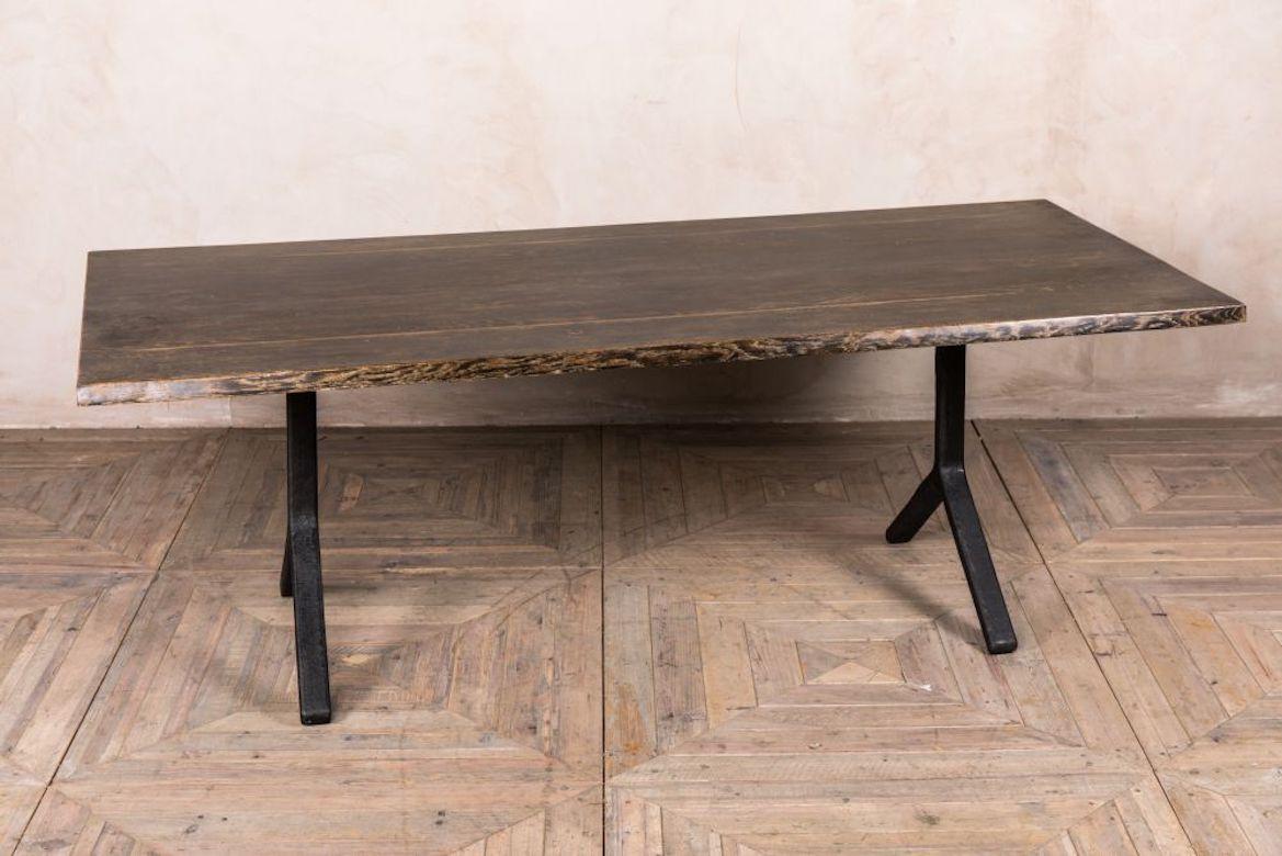 A fine dark oak and iron dining table, 20th century.

New to our collection of industrial inspired dining furniture, this Y-base table has plenty of vintage and contemporary charm. 

The table has a cast iron base in an upside-down Y-leg design.