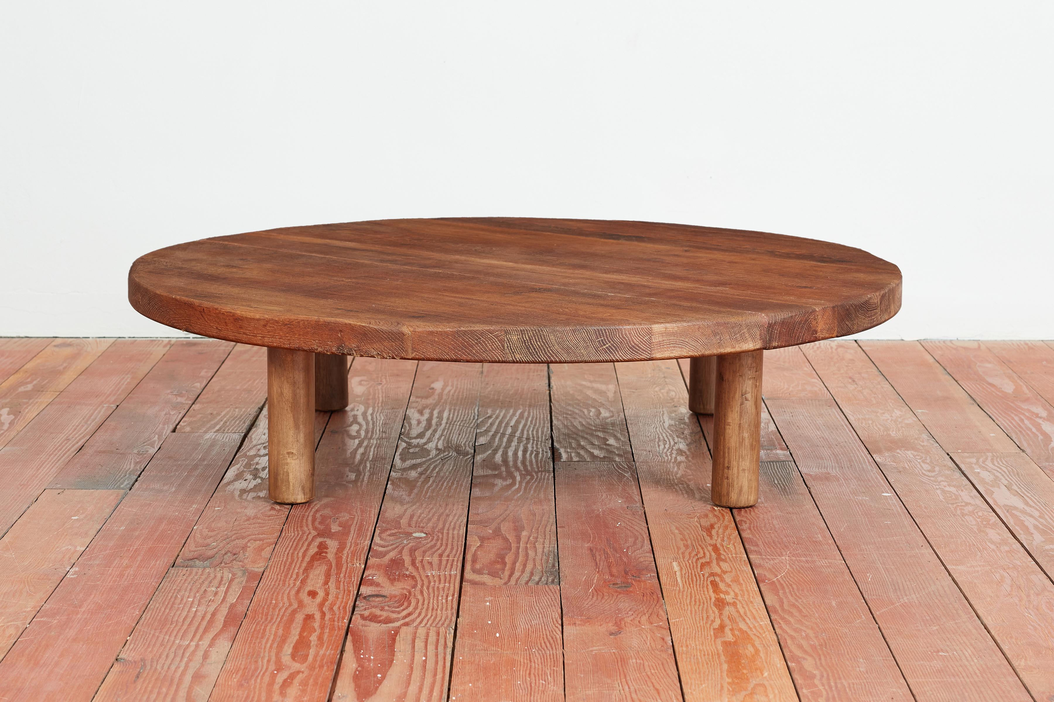 Beautiful large scale coffee table constructed of dark oak with wonderful patina and wood grain. 

Simple lines indicative of Charlotte Perriand.

France, 1950s