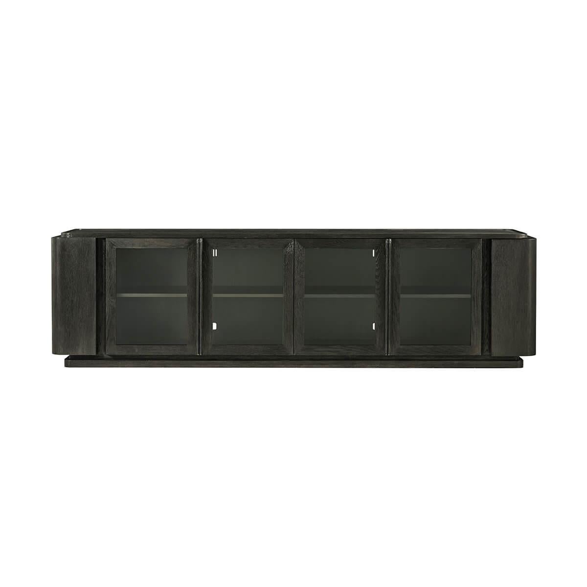 an extra long and low media console in a dark charcoal finish boasting solid Oak and veneer construction that rests on a plinth base.

Hidden on the ends are curved doors that conceal two small shelves to store away small items while the front has