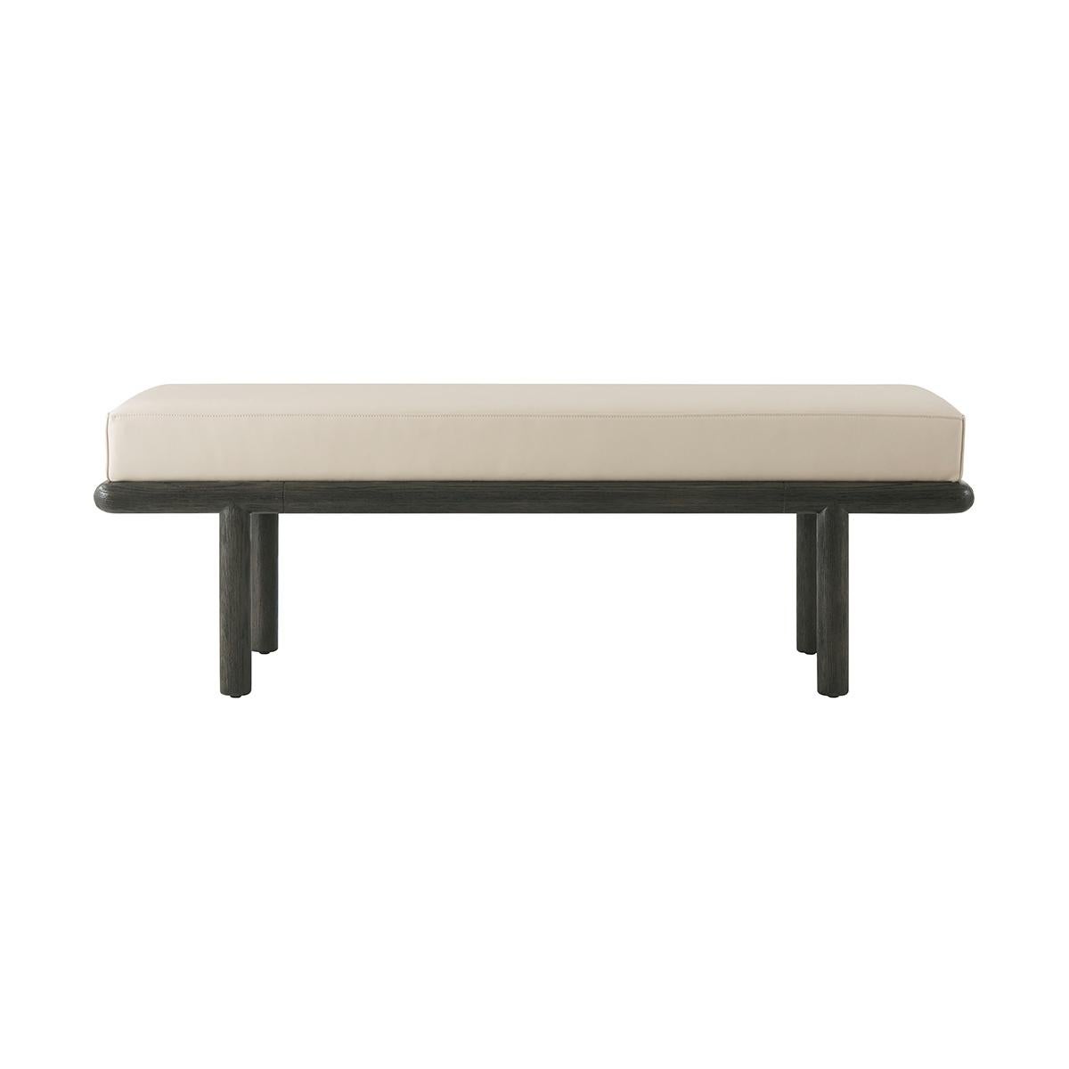 With a boxed leather upholstered cushion, the frame of this naturally designed upholstered bench is skillfully hand-finished with an intensive multi-step process, resulting in a beautifully brushed type of finish making the visible grain from the