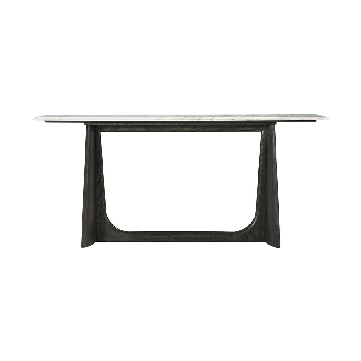 Featuring a wire-brushed white oak in our dark charcoal finish. With a Volakas marble top raised on trapezoidal form trestle ends with a stretcher.

Dimensions: 72