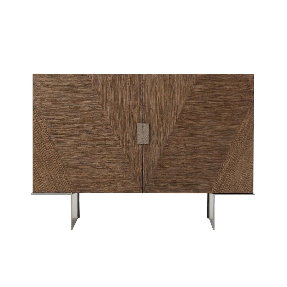 Dark oak Modern media cabinet, in our brushed oak Charteris finish with a subtle chevron parquetry detail on the doors. The split interior with an adjustable shelf to one side and central drawer on the other. The cabinet is raised on a cantilevered