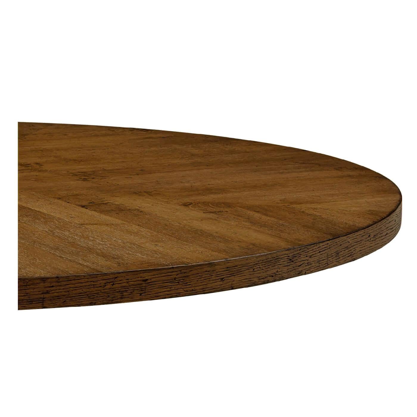 A dark oak parquetry round dining table with column pyramid base. This elegant table is detailed with a herringbone oak parquetry base and radial veneered top. It has been hand-made and given our Dusk finish.

Shown in Dusk Finish
Dimension
54