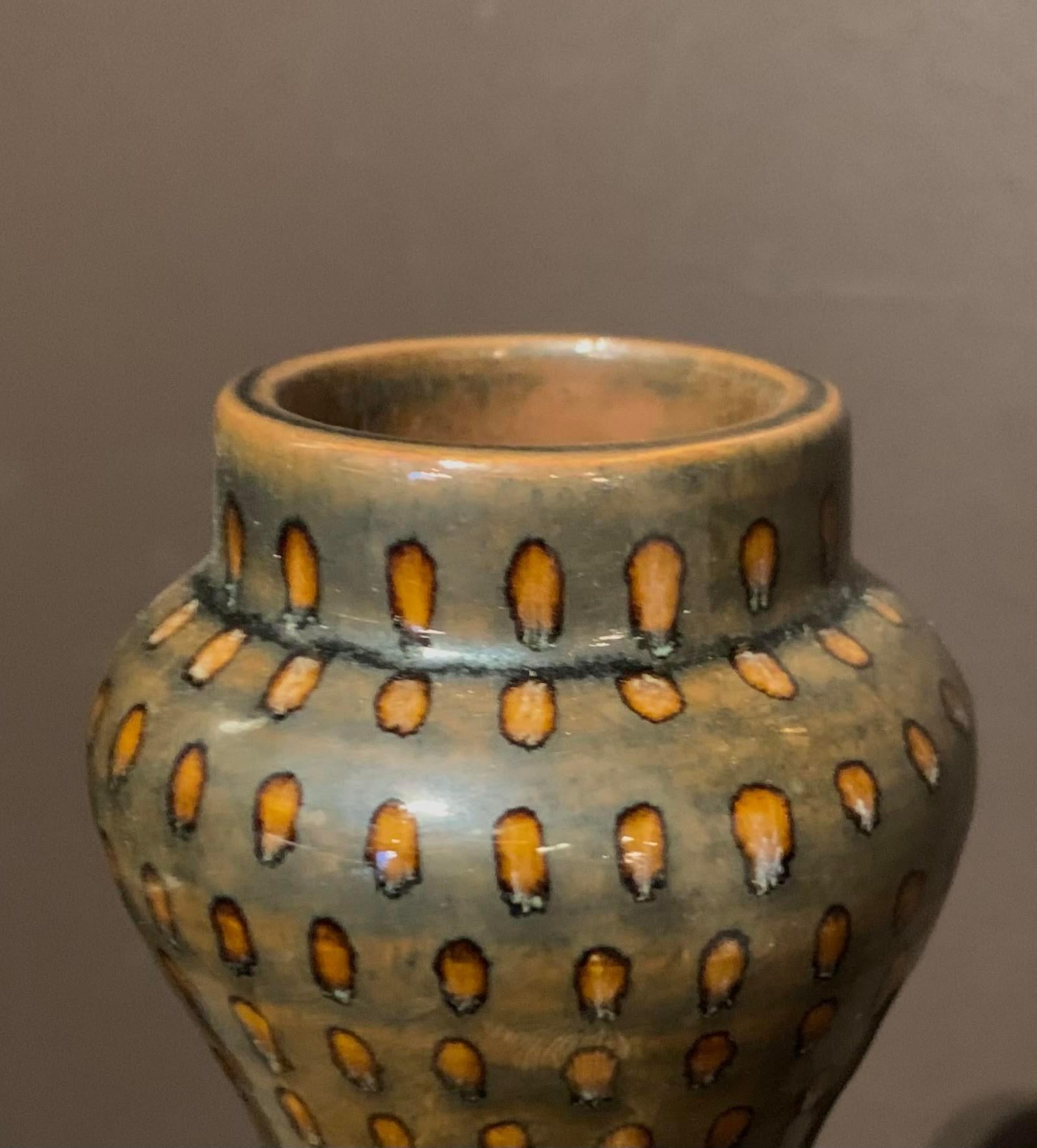 Contemporary Chinese handmade pin dotted vase.
Dark olive with orange dots all applied using a fine quill paint brush.



