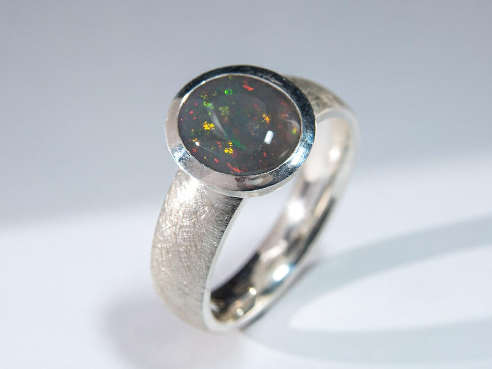 Silver ring with natural Dark Opal
opal origin - Australia
stone measurements - 0.35 х 0.39 in / 9 х 10 mm
stone weight - 1.5 carats
ring weight - 6.16 grams
ring size - 9 US