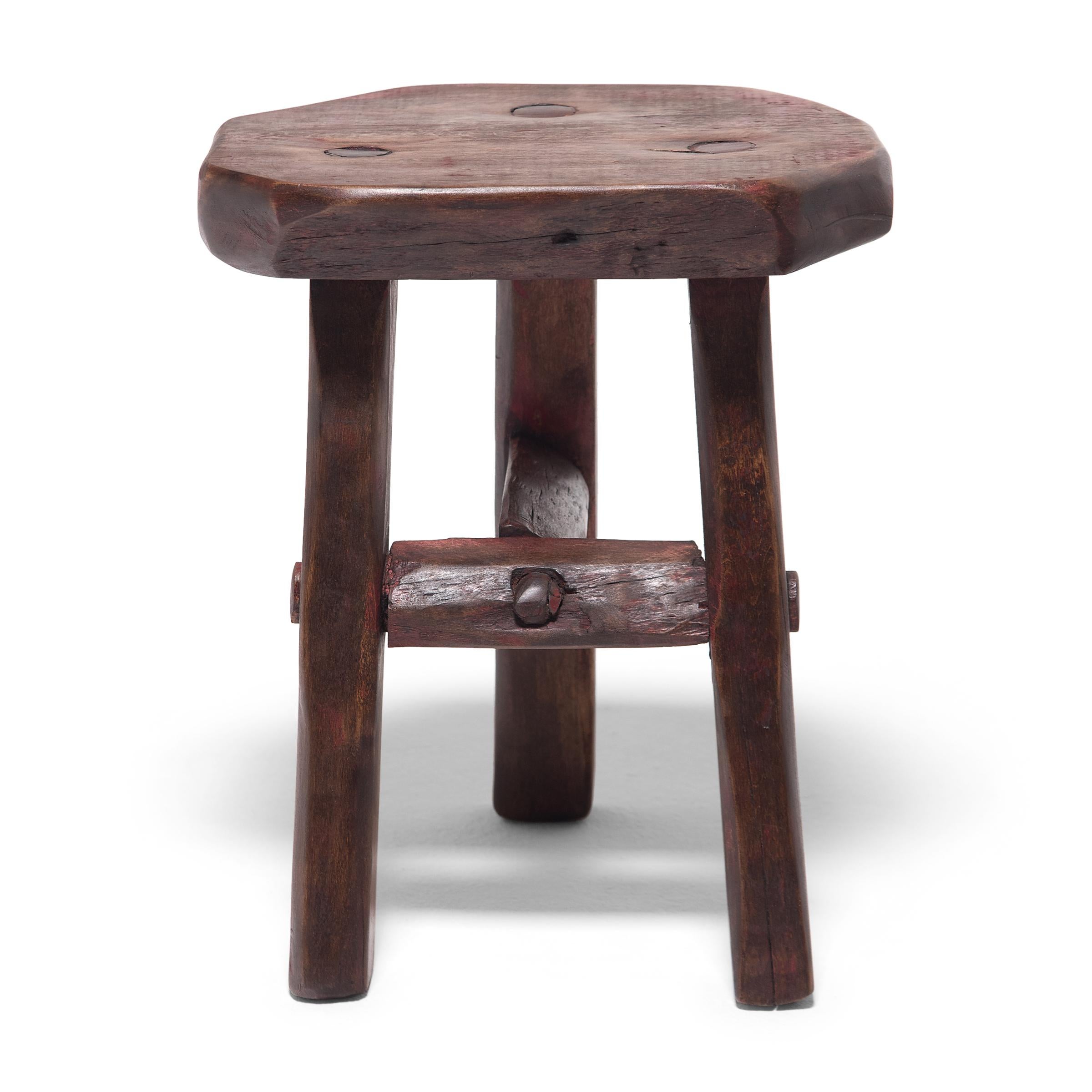 Crafted of wood reclaimed from 18th-century Chinese buildings, this contemporary four-leg stool is the epitome of farmhouse modern. Darkened with a red-brown finish, the little stool embraces the concept of “wabi-sabi” with irregular edges and