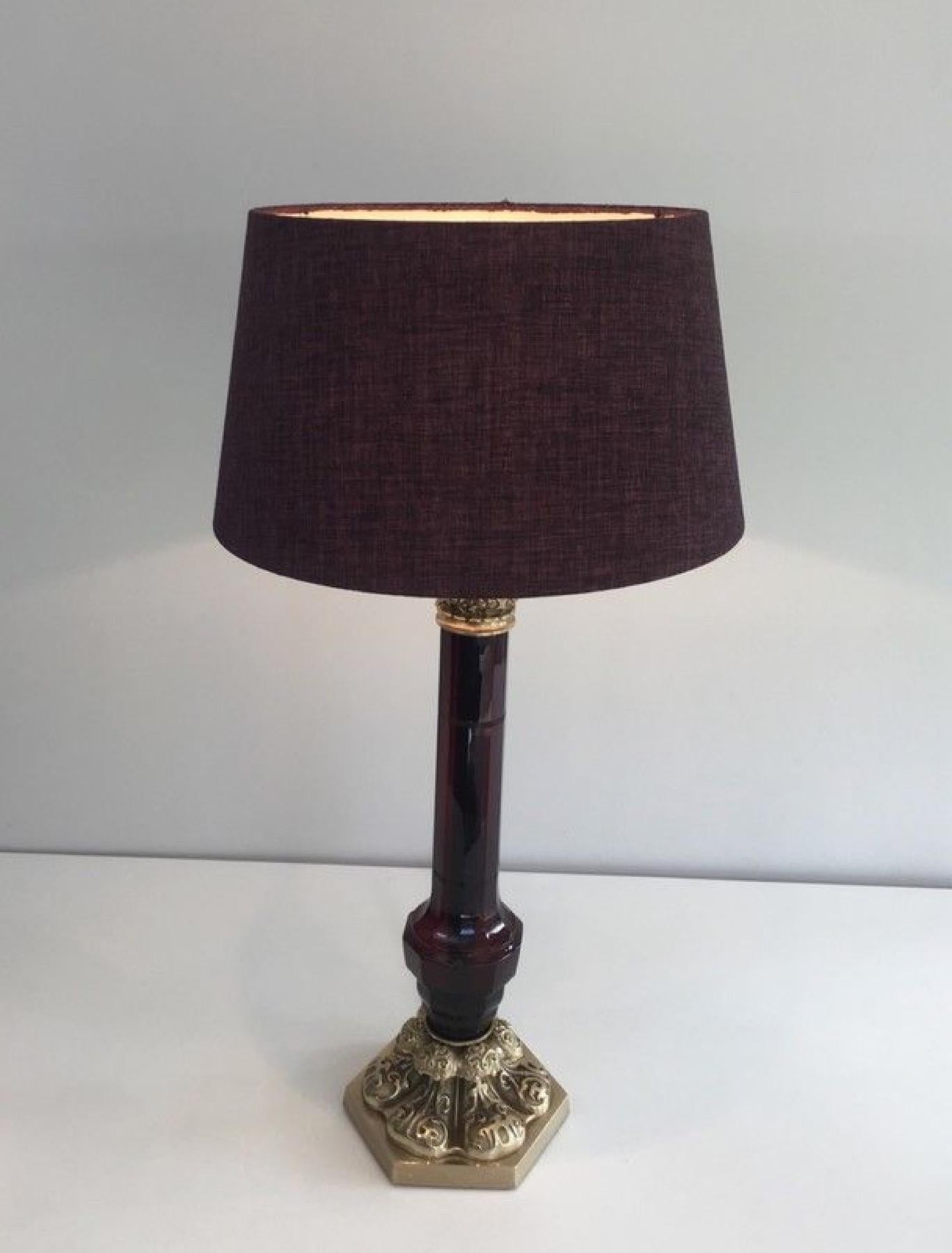 This very nice table lamp is made of dark red cristal with a very nicely chiseled bronze base. The quality of the lamp is very nice. This is a French work by Cristal & Bronze Paris. Circa 1940