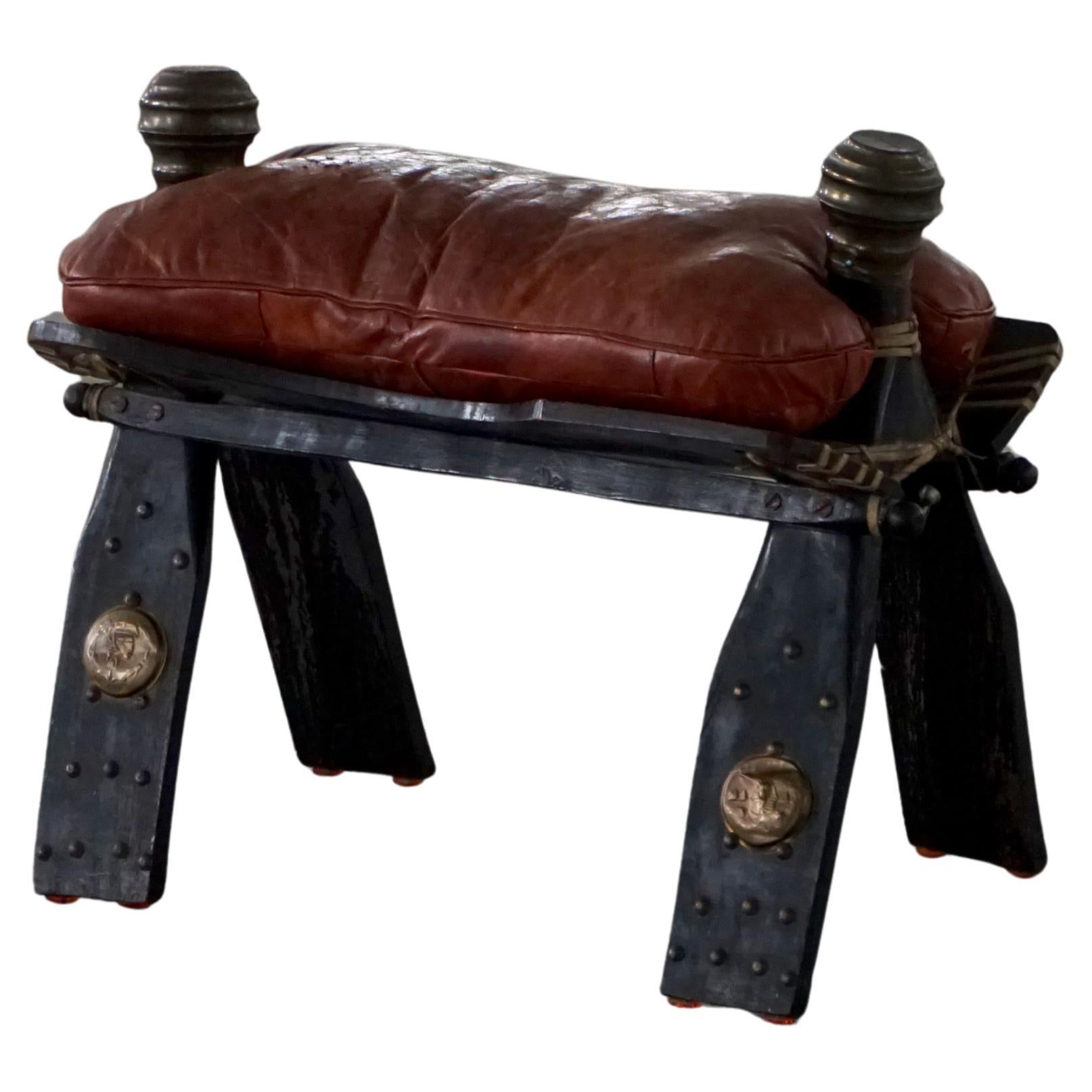 Dark Red Upholstered Moroccan Camel Saddle Footstool, 20th Century, North Africa For Sale