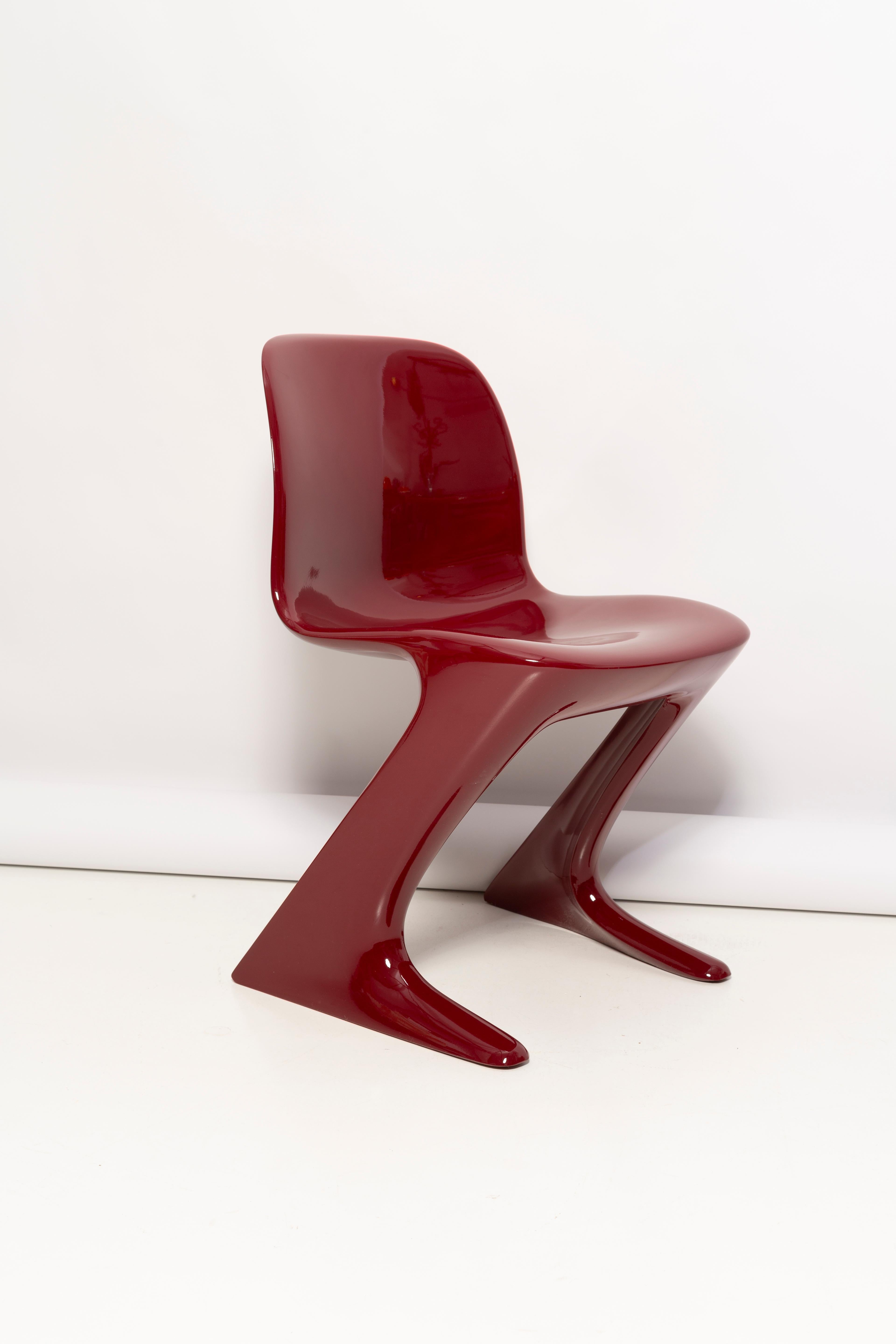 This model is called Z-chair. Designed in 1968 in the GDR by Ernst Moeckl and Siegfried Mehl, German Version of the Panton chair. Also called kangaroo chair or variopur chair. Produced in eastern Germany.

Chair is after full renovation, glossy red