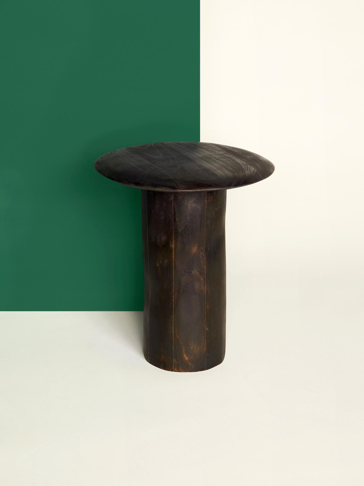 Dark sculptural side table pedestal - Albane Salmon
Dimensions: 36.5 x 31 x 31 cm
Sculpted, burnt and brushed beech
One of a kind.
Variations possible on demand

Each part of those pieces of furniture is hand shaped and
textured without using