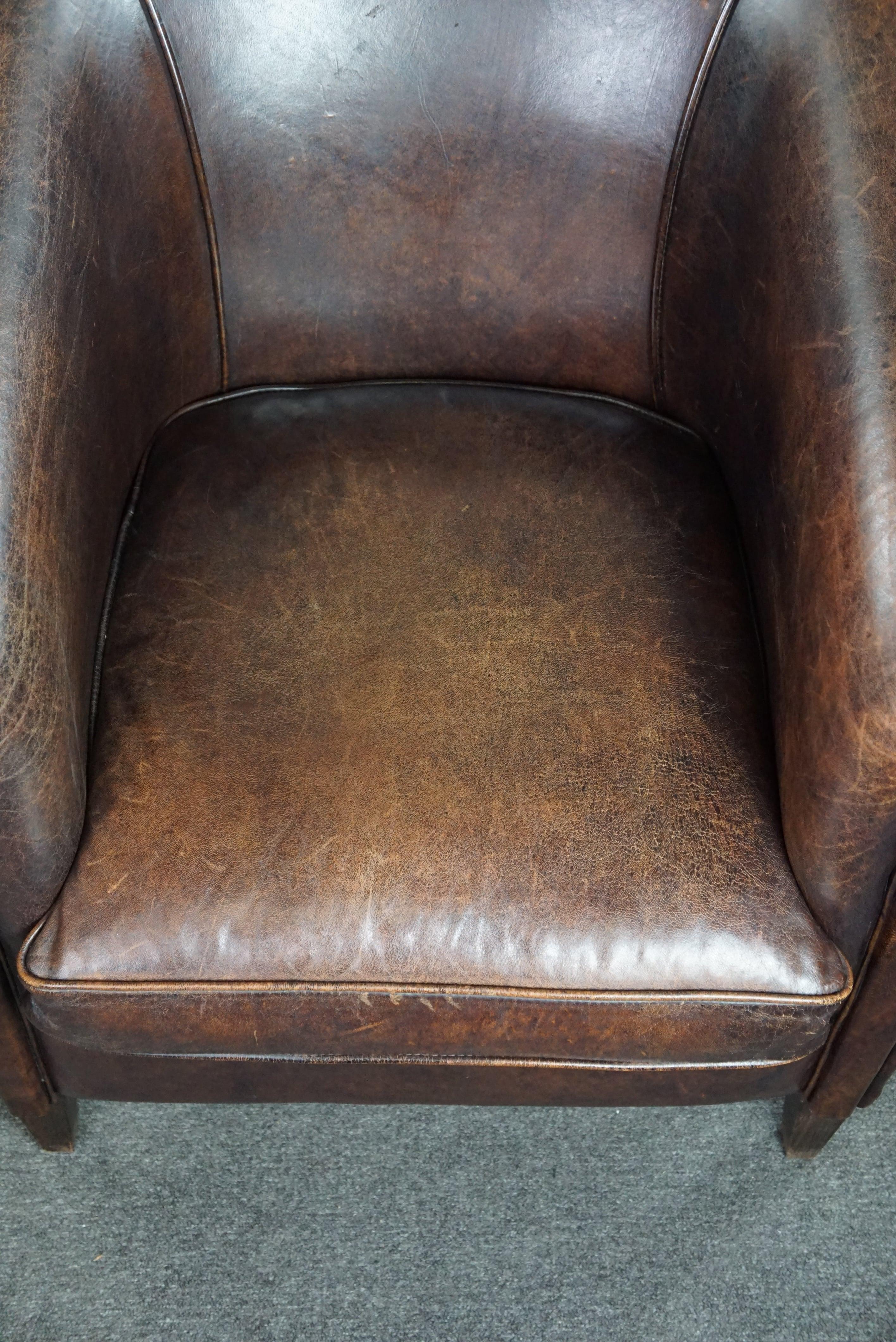 Dark sheep leather club armchair, sleek design For Sale 1